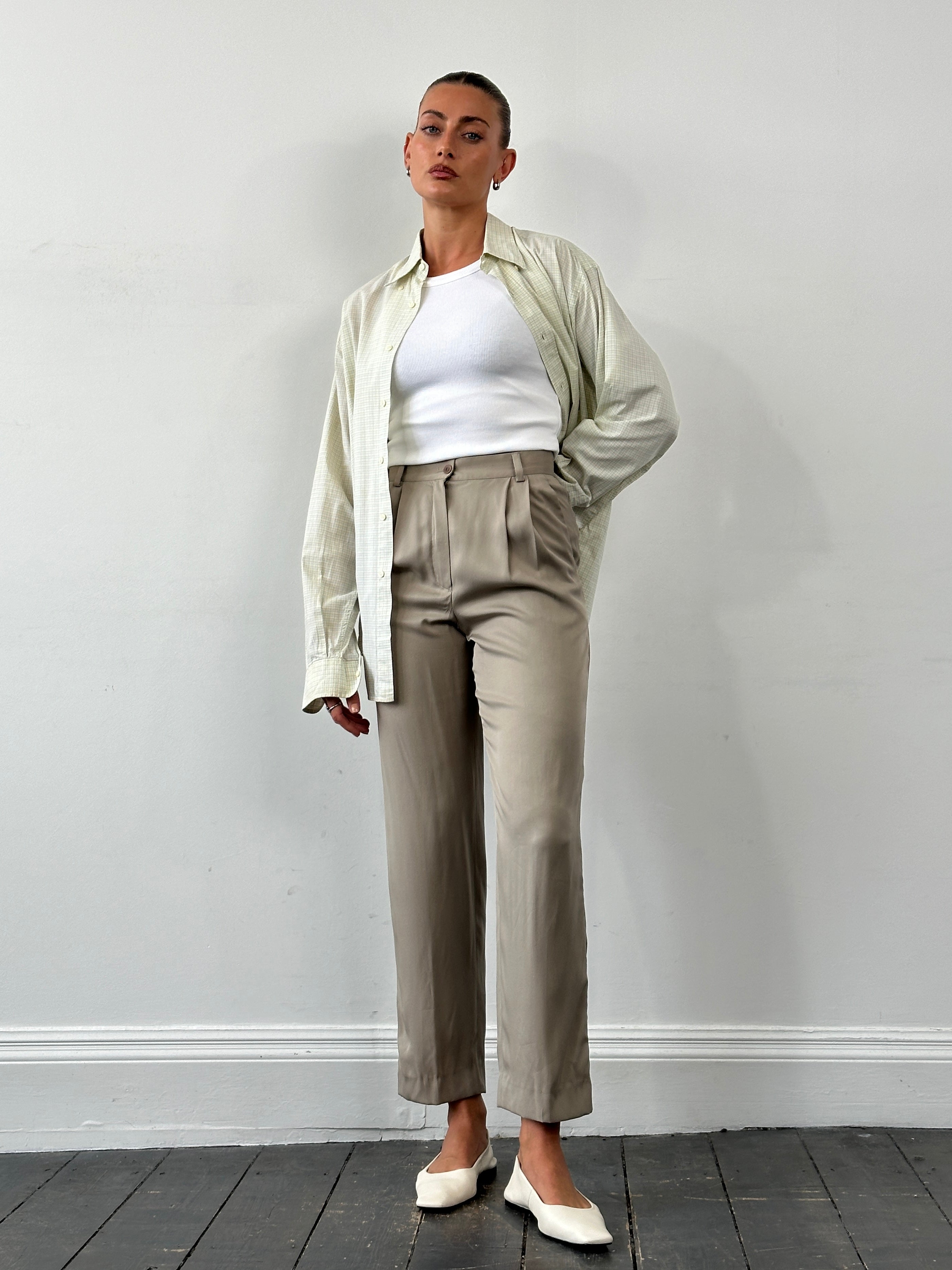 Mani Pure Silk high-waisted trousers in size W26, featuring a sleek fit and elegant design, displayed on a neutral background.