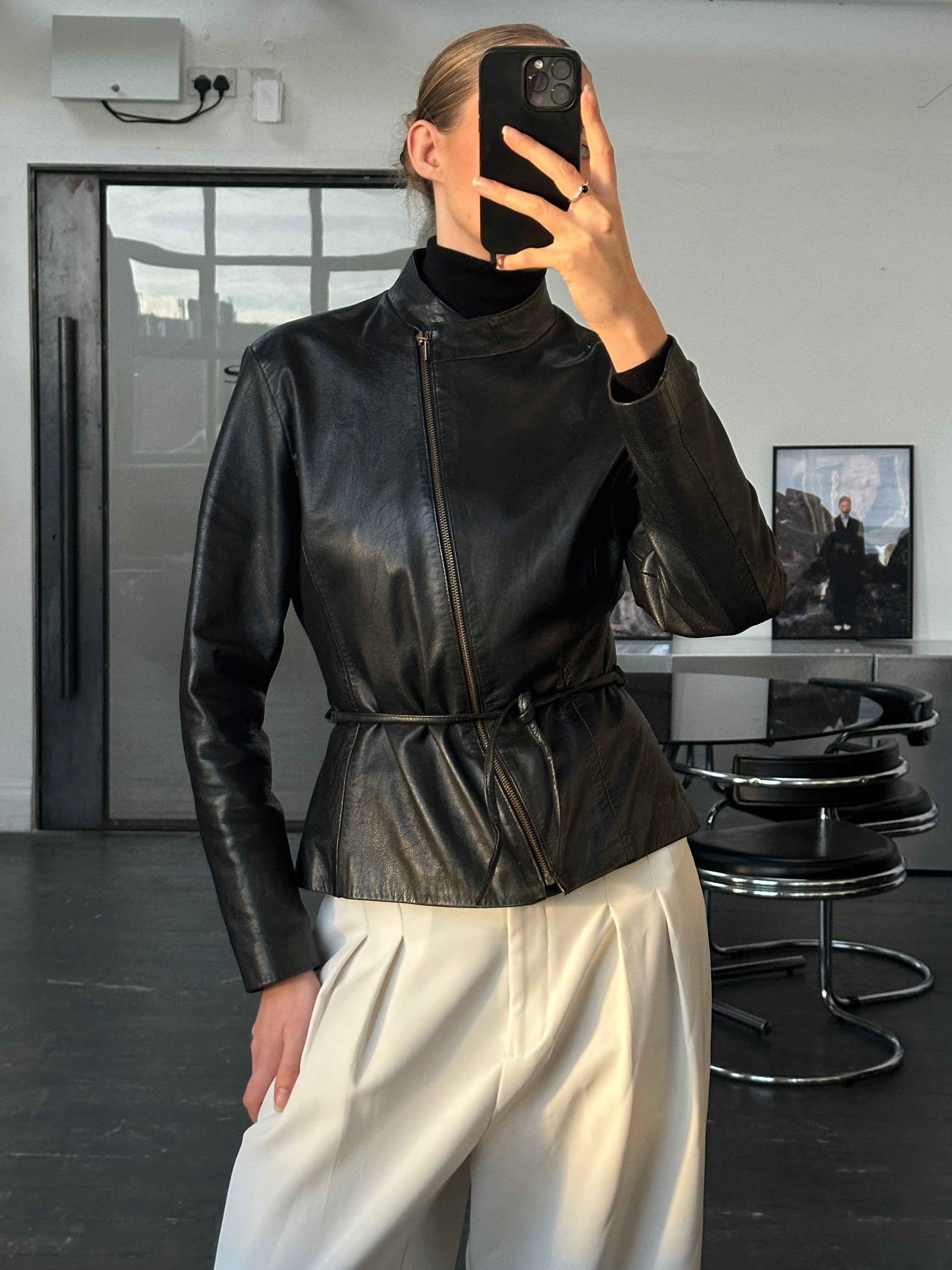 Vintage 2000s asymmetric leather jacket with tie belt, slim fit, and classic design, featuring textured leather and stylish detailing.