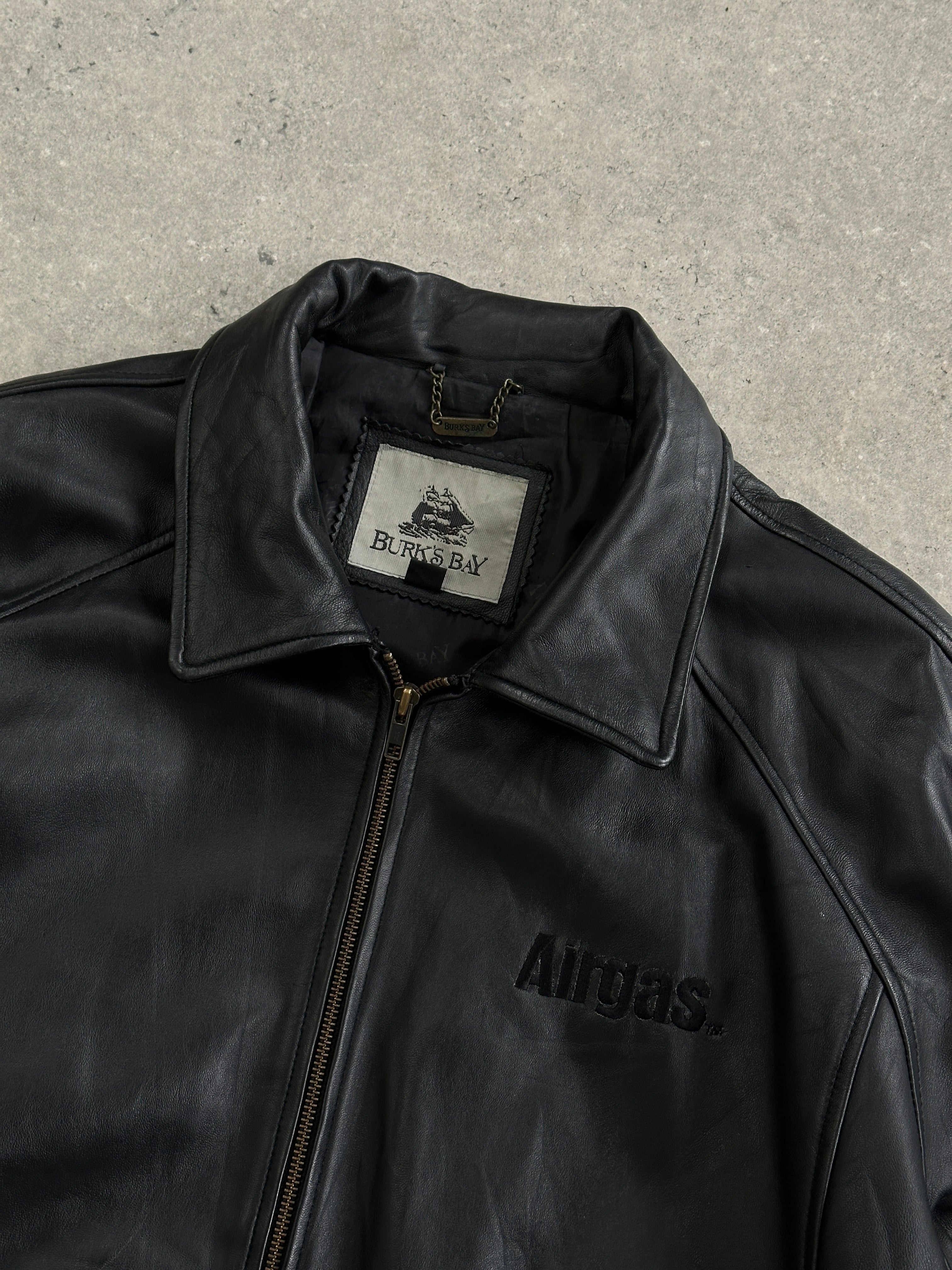 Vintage leather bomber jacket with intricate embroidery, size large/X-large, stylish vintage leather jacket for men or women.