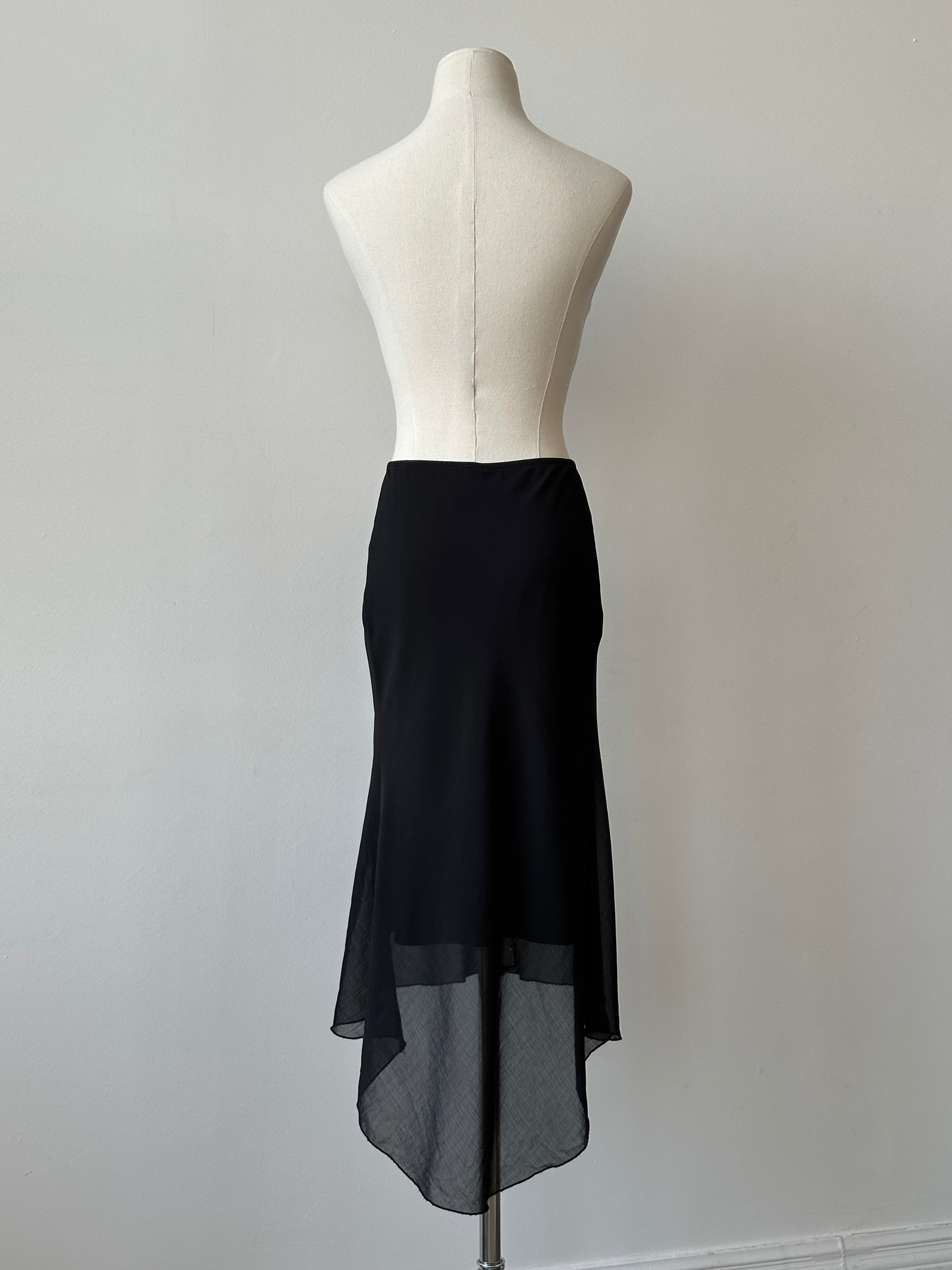 Vintage 1990s asymmetric midi skirt in denim fabric with raw hem and unique design, showcasing retro style and W29 size.