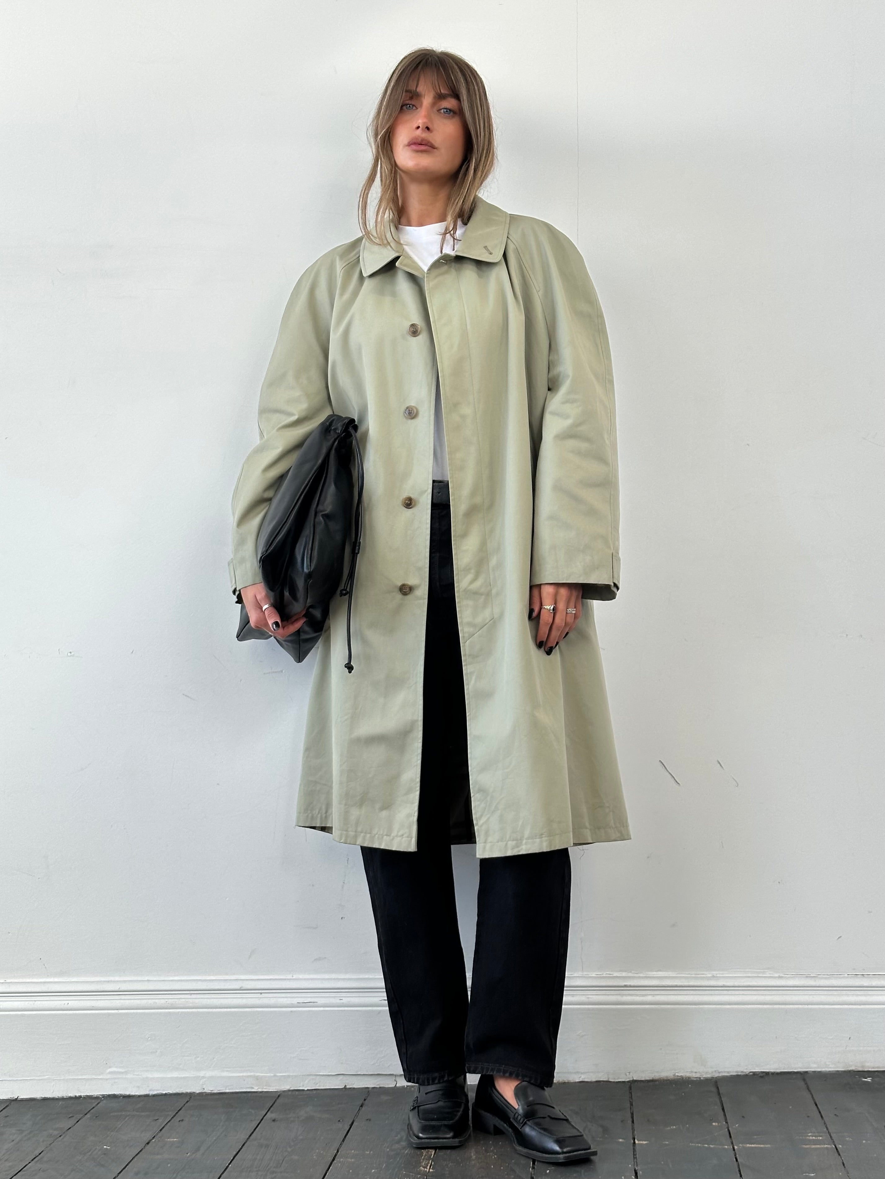 Yves Saint Laurent concealed placket trench coat in XXL, stylish beige coat with classic design and button details.