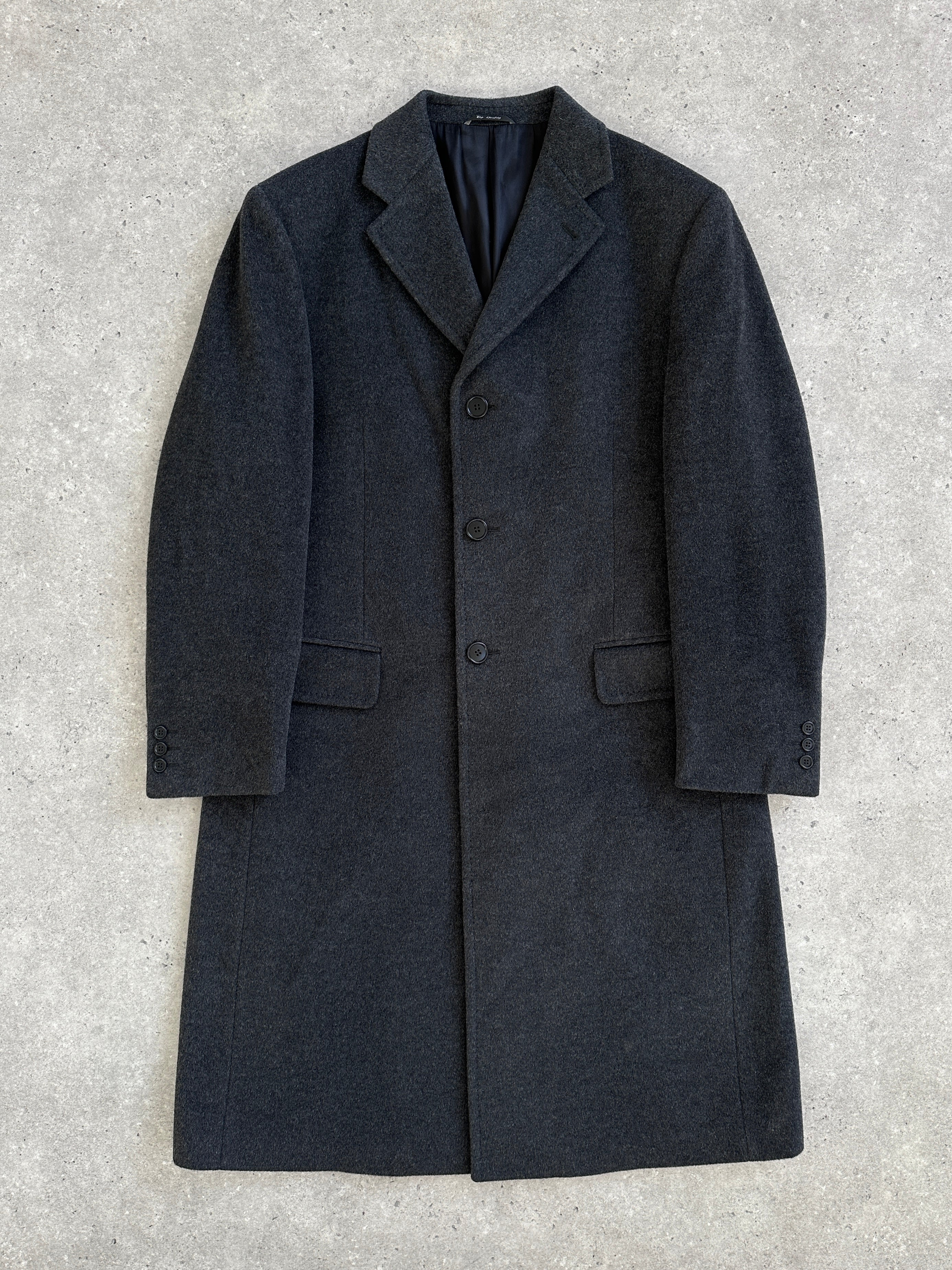 Vintage Italian 1990s wool and cashmere coat in XL with classic tailored design and neutral color, displayed on a hanger.