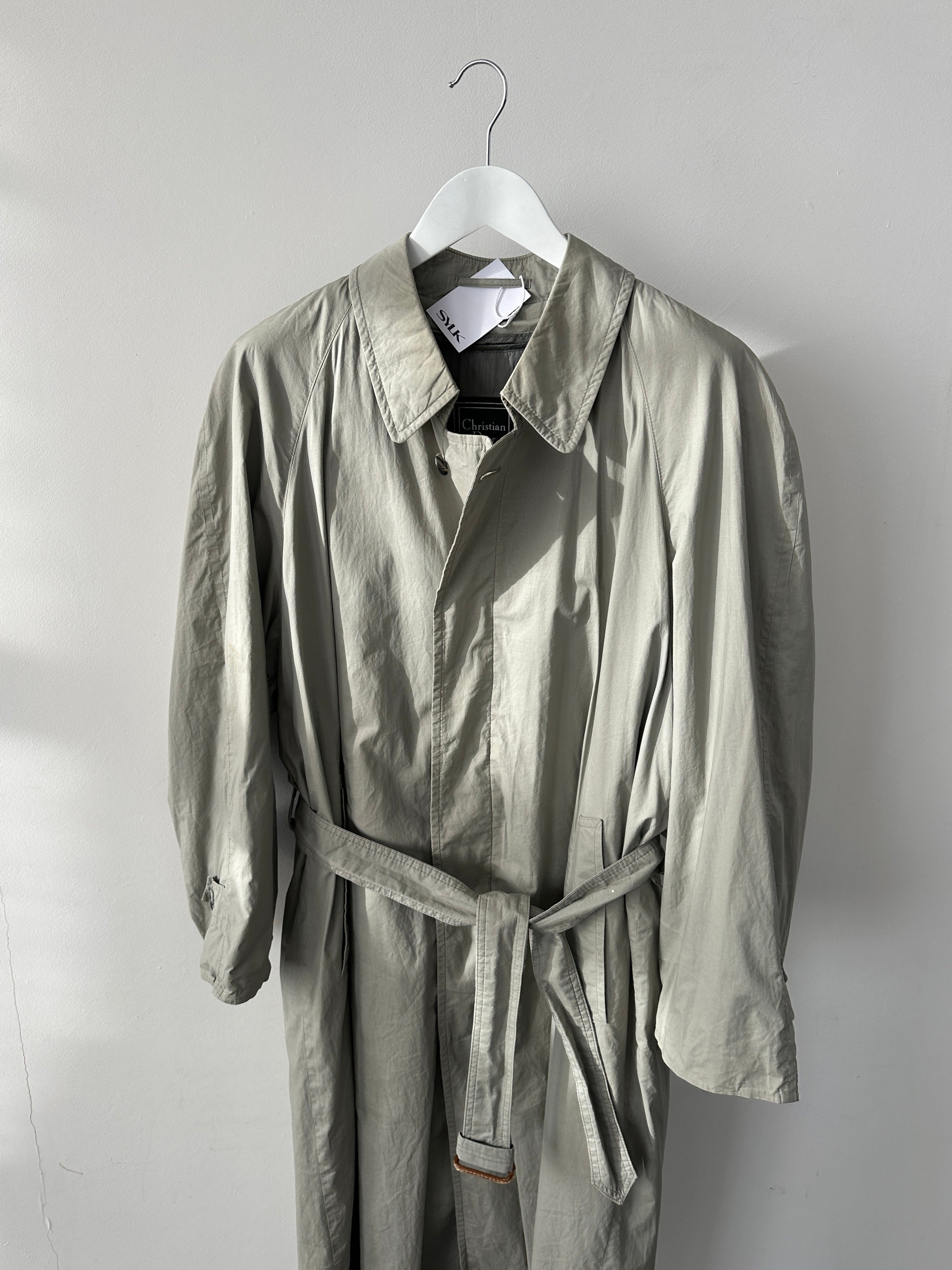 Christian Dior Le Connaisseur belted trench coat in beige, tailored with a classic collar and side pockets, size M.