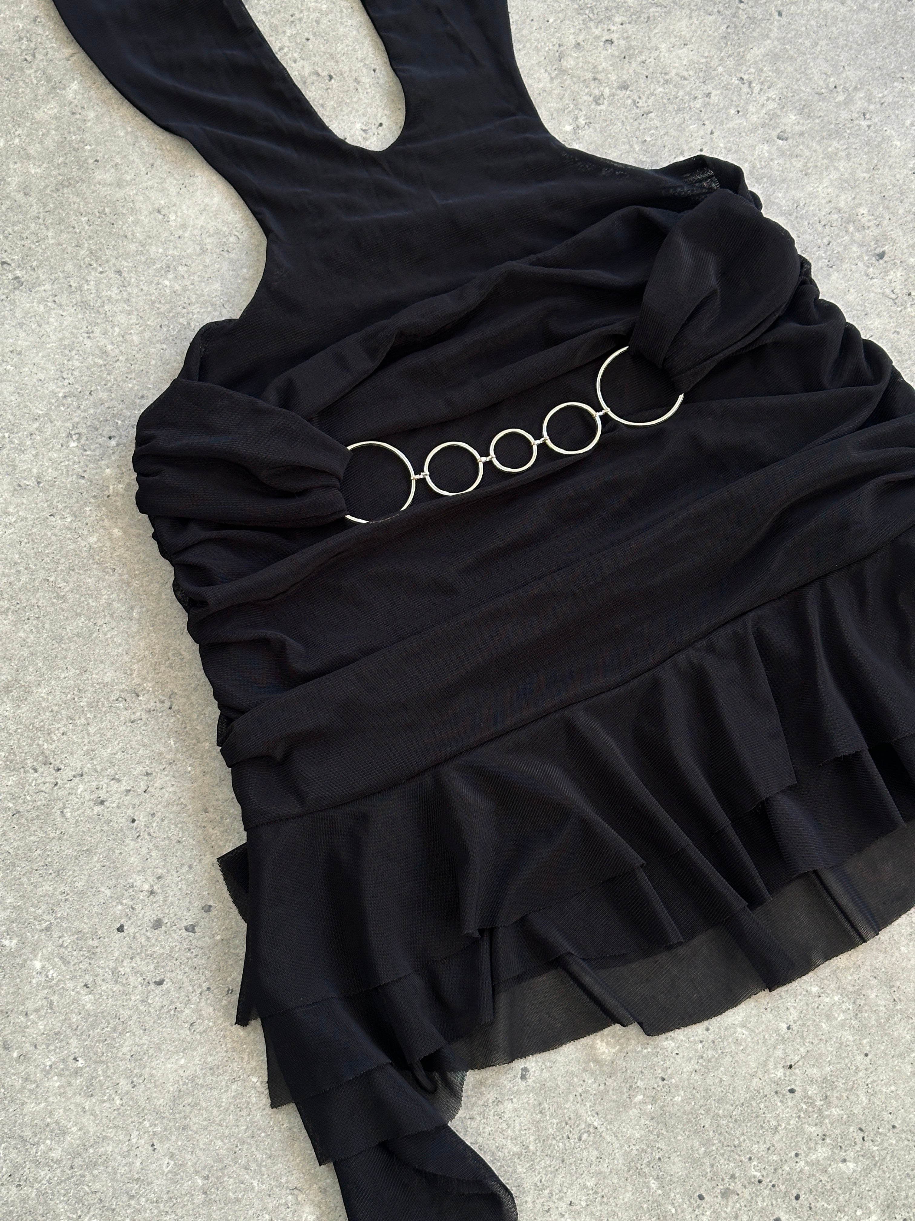 Vintage 1990s layered ruffle mini skirt, size small, featuring a playful ruffle design and vintage fabric details.