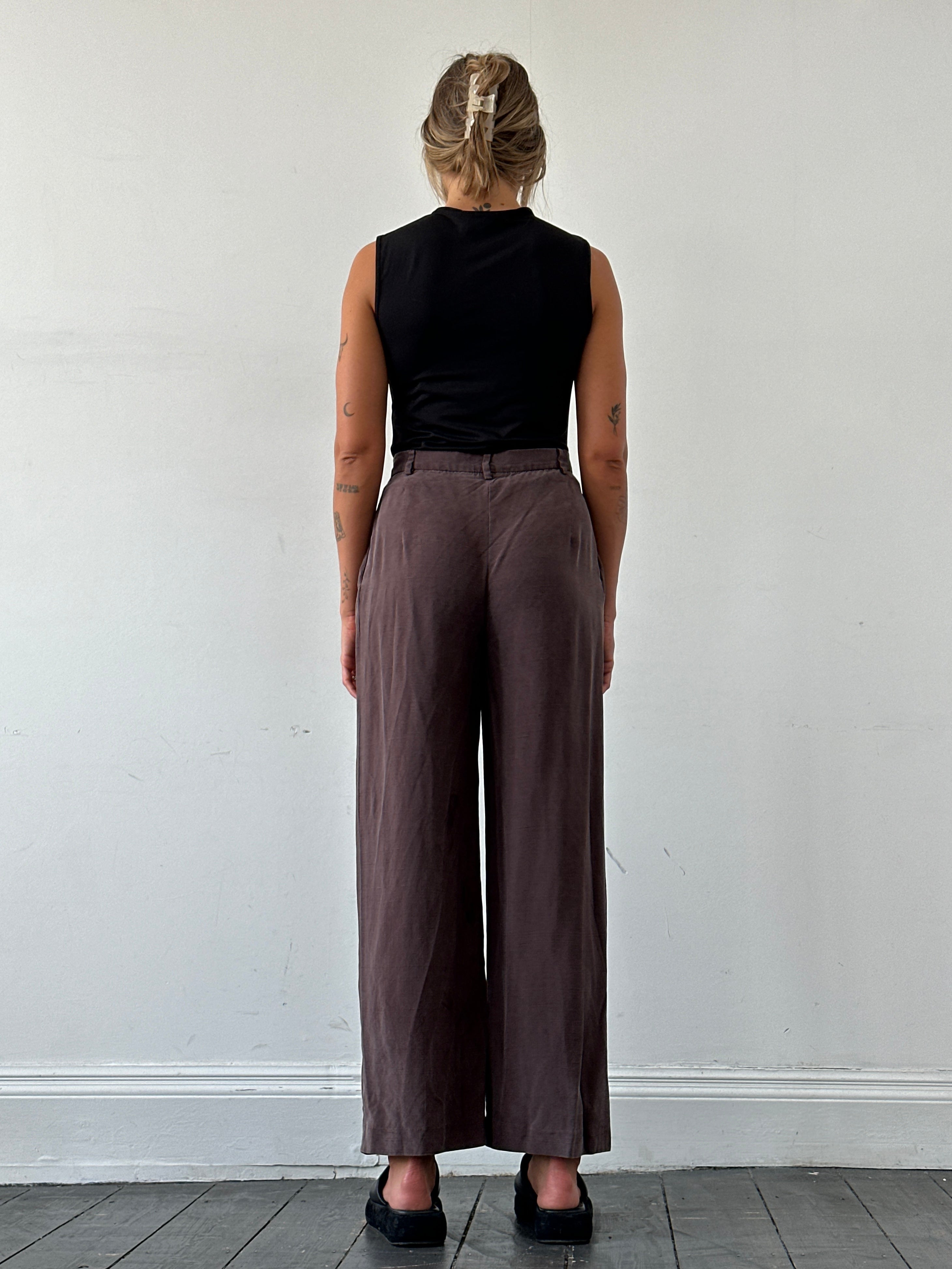 Max Mara pure silk wide-leg high-waisted trousers in W28, shown in a natural pose, highlighting elegant fabric and tailored fit.