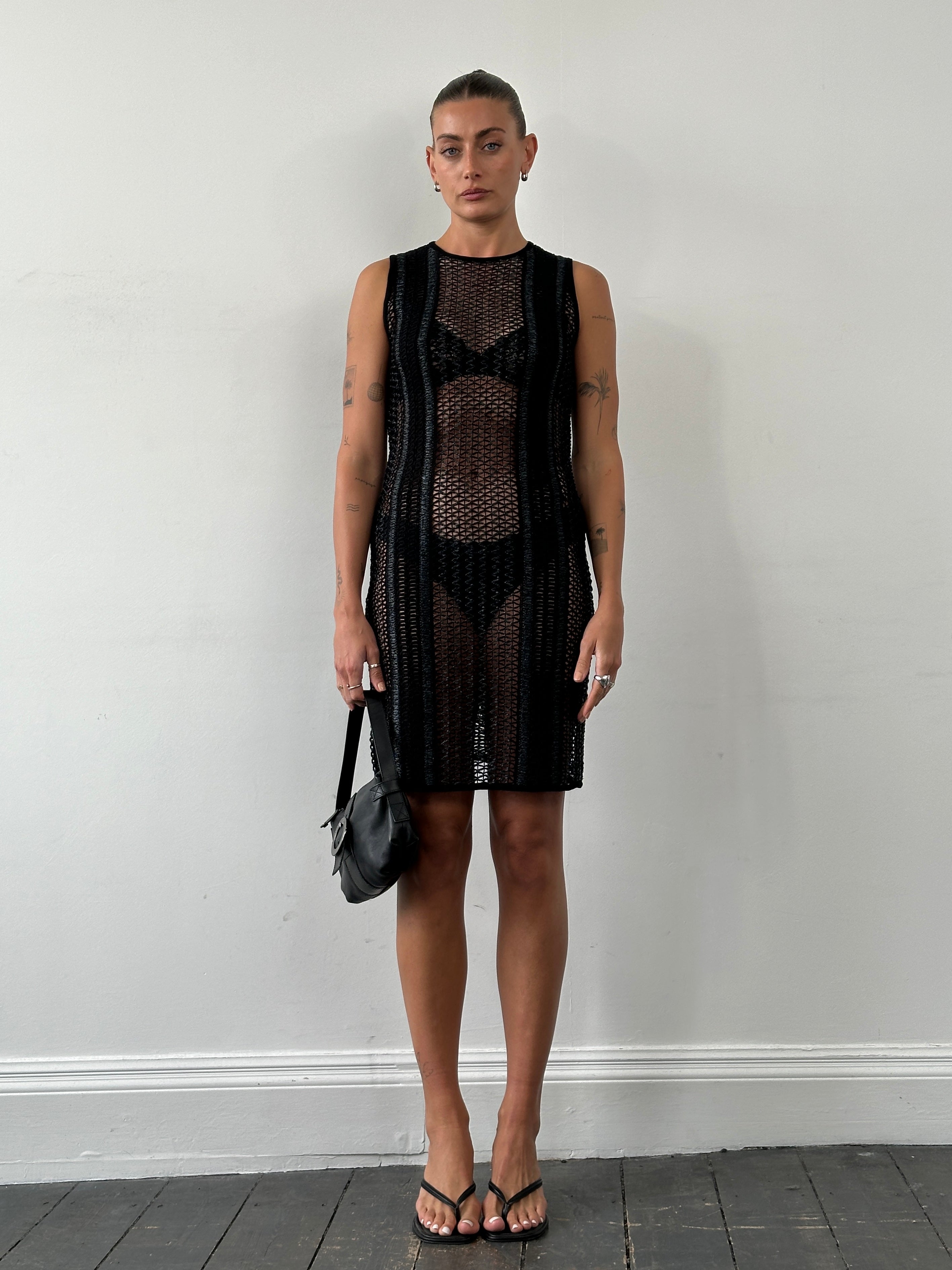 Vintage rattan crochet mini dress in S/M, featuring intricate crochet details and a vintage-inspired design.