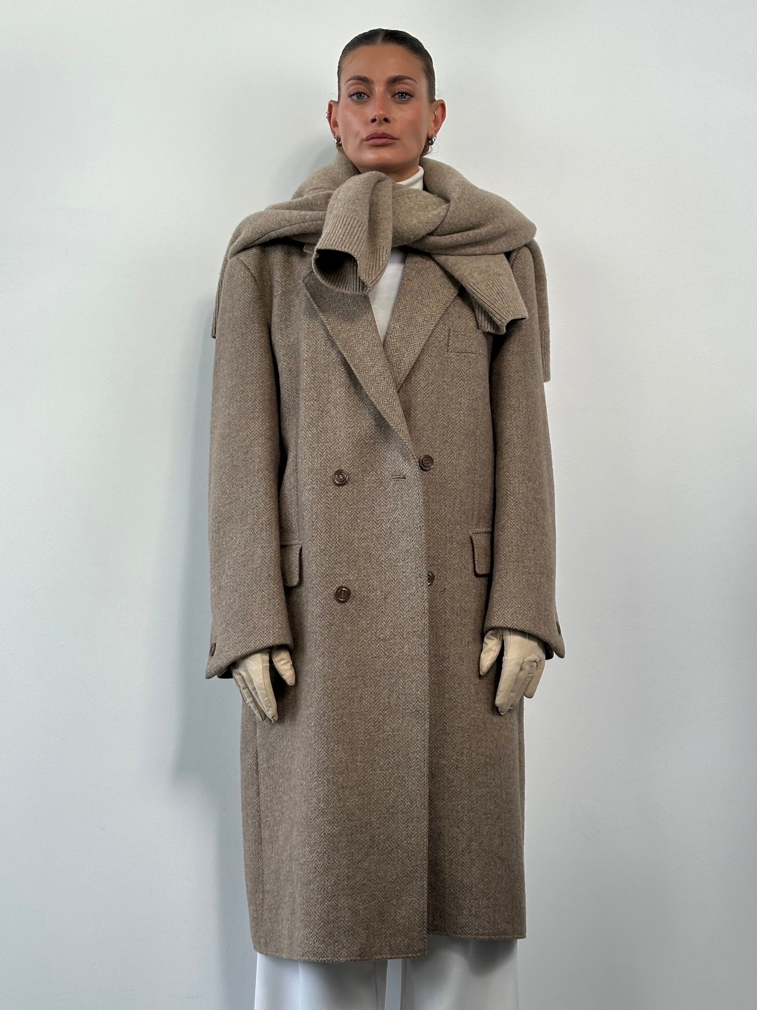 Vintage wool herringbone double-breasted coat in XL, featuring classic style and tailored fit, displayed on a hanger.