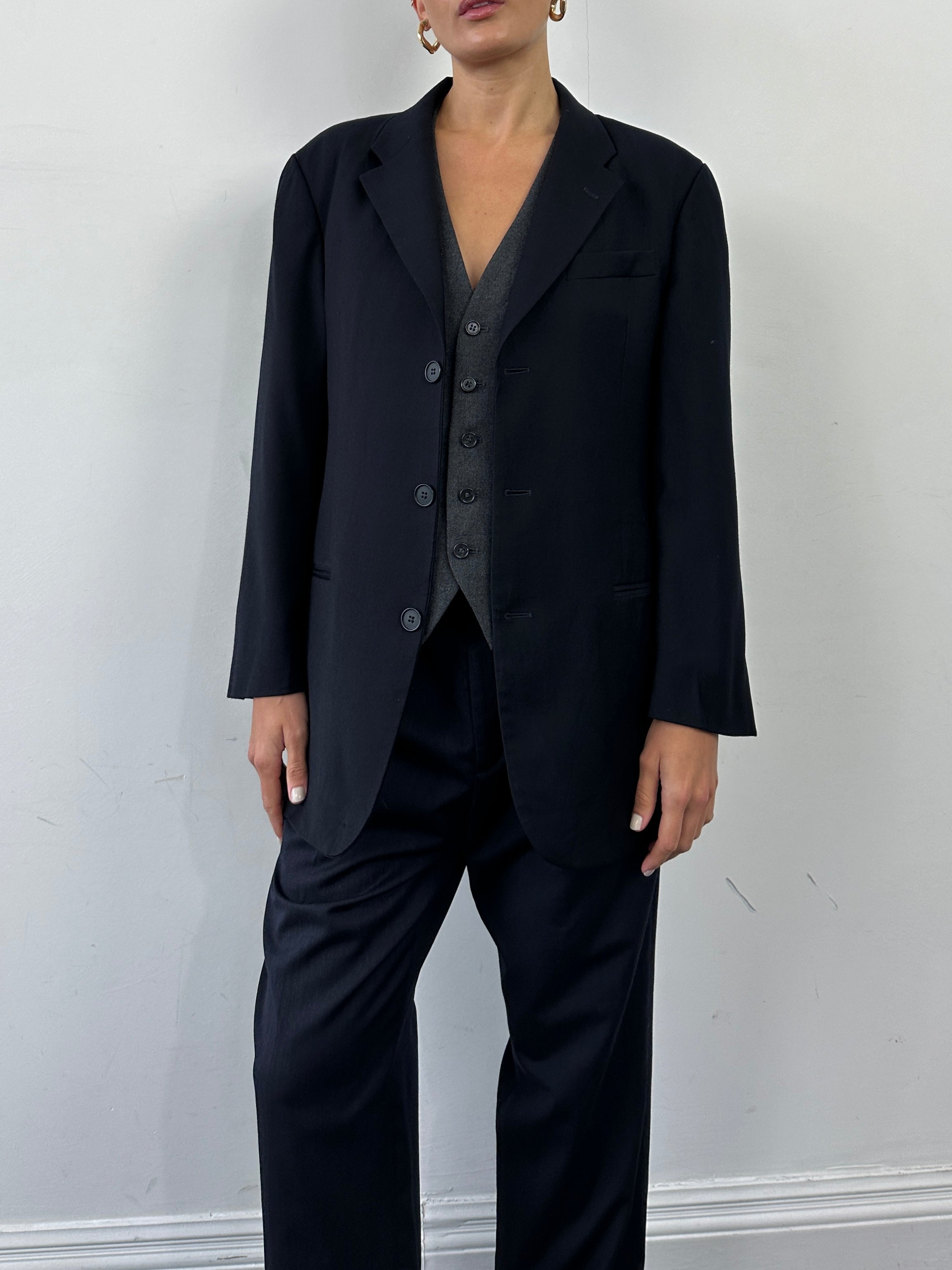 Emporio Armani wool single-breasted blazer in size M/L, tailored fit with classic lapel and button closure, in a dark color.