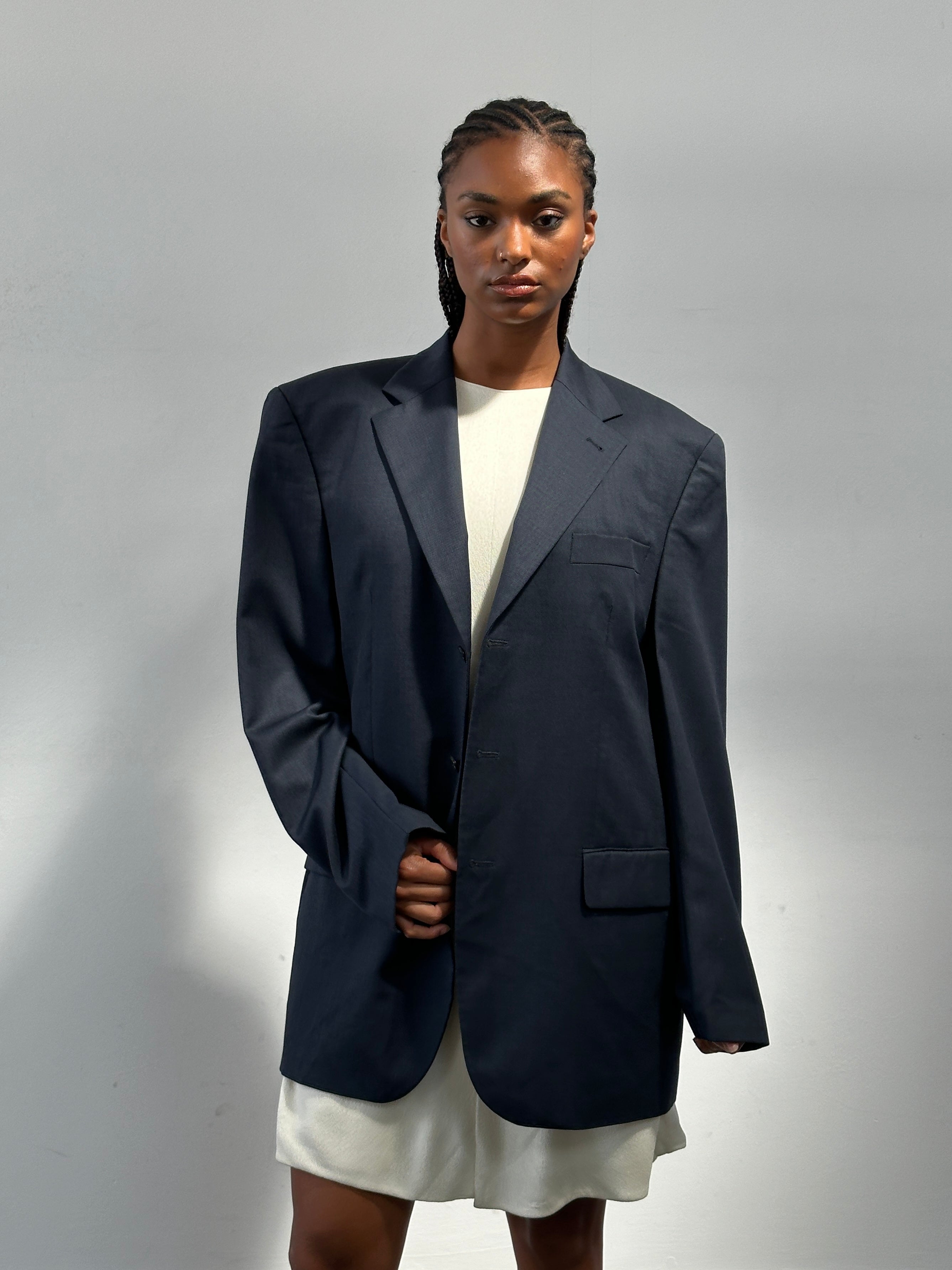 Yves Saint Laurent Pour Homme 1990s pure wool single-breasted blazer in size 42R/XL, shown in classic navy with notch lapel.