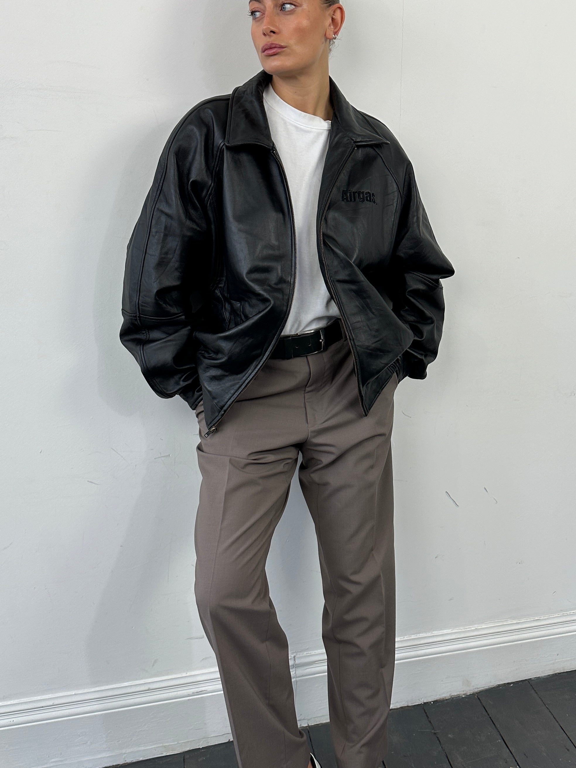 Vintage leather bomber jacket with vintage embroidery, size large/extra-large, stylish and casual outerwear.