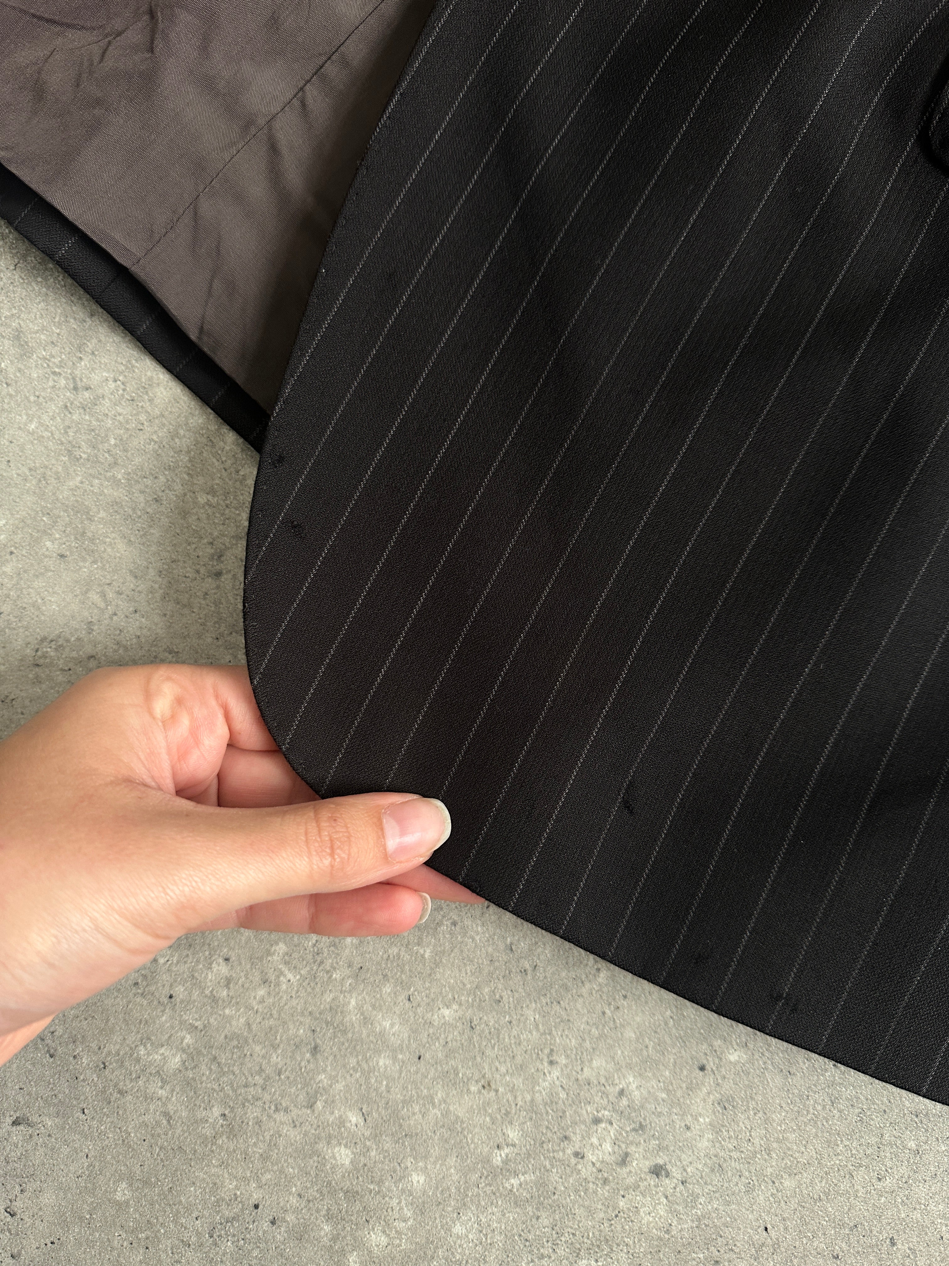 Armani Collezioni pinstripe pure wool single-breasted blazer in size 40R, showing the tailored fit and classic lapel design.