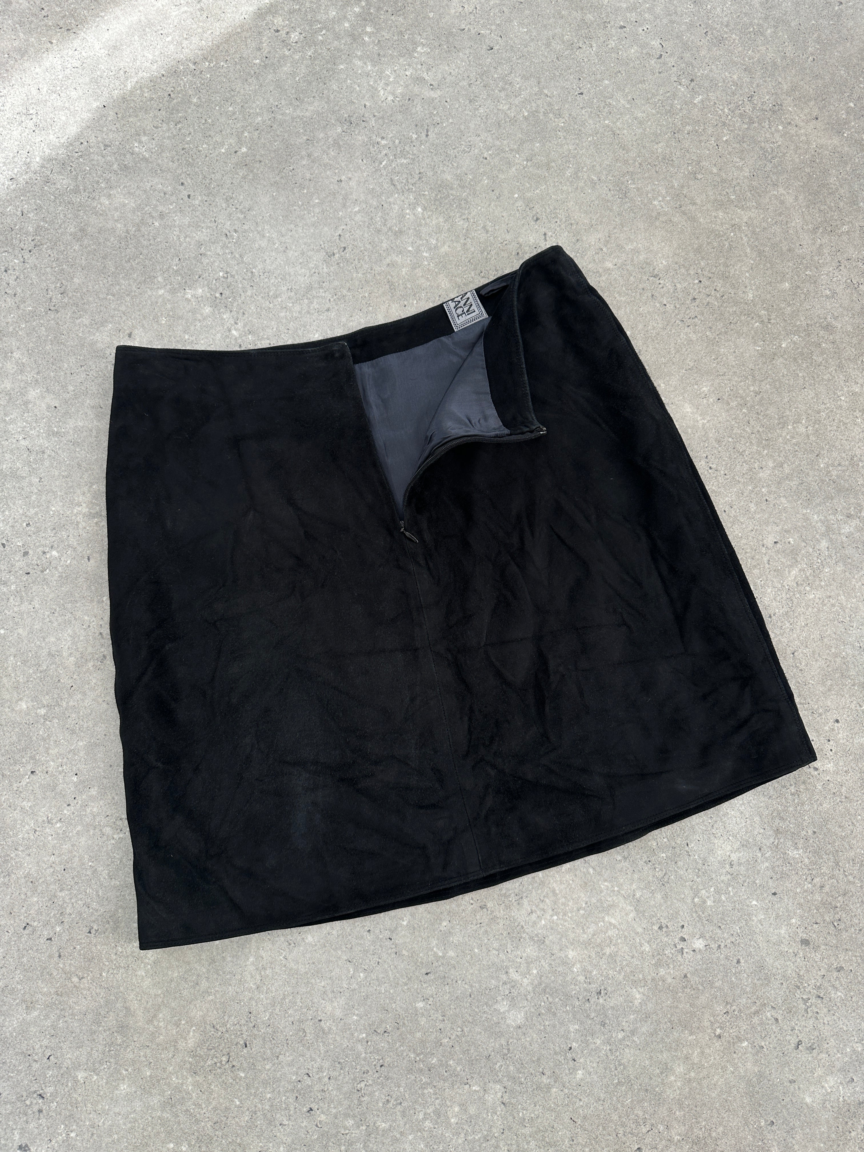 Gianni Versace 1990s suede mini skirt in W30, showcasing a stylish high-waisted design and rich suede texture.