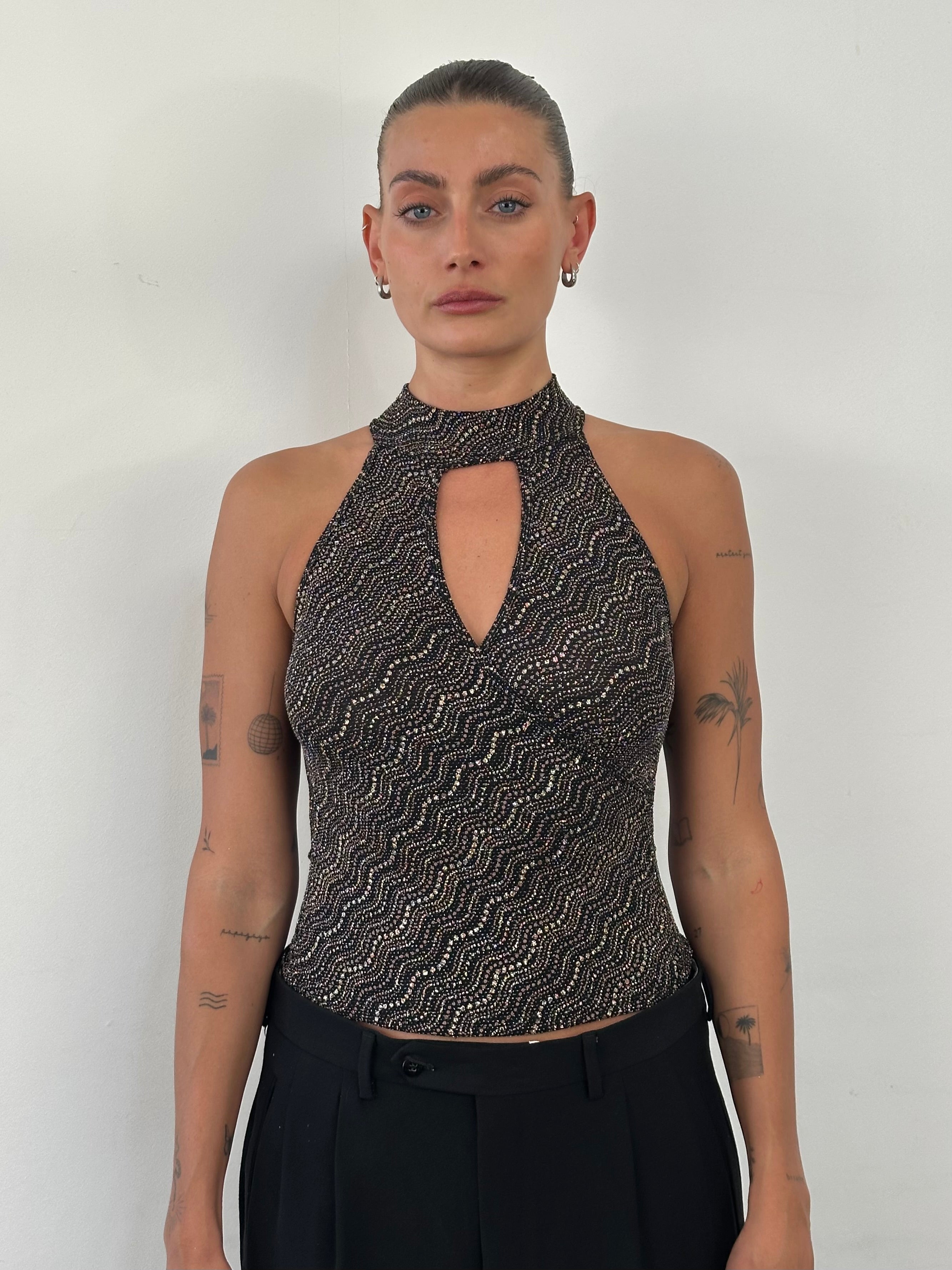Vintage French sleeveless glittery high-neck tank top in size S, featuring a shiny, elegant fabric and high neckline.