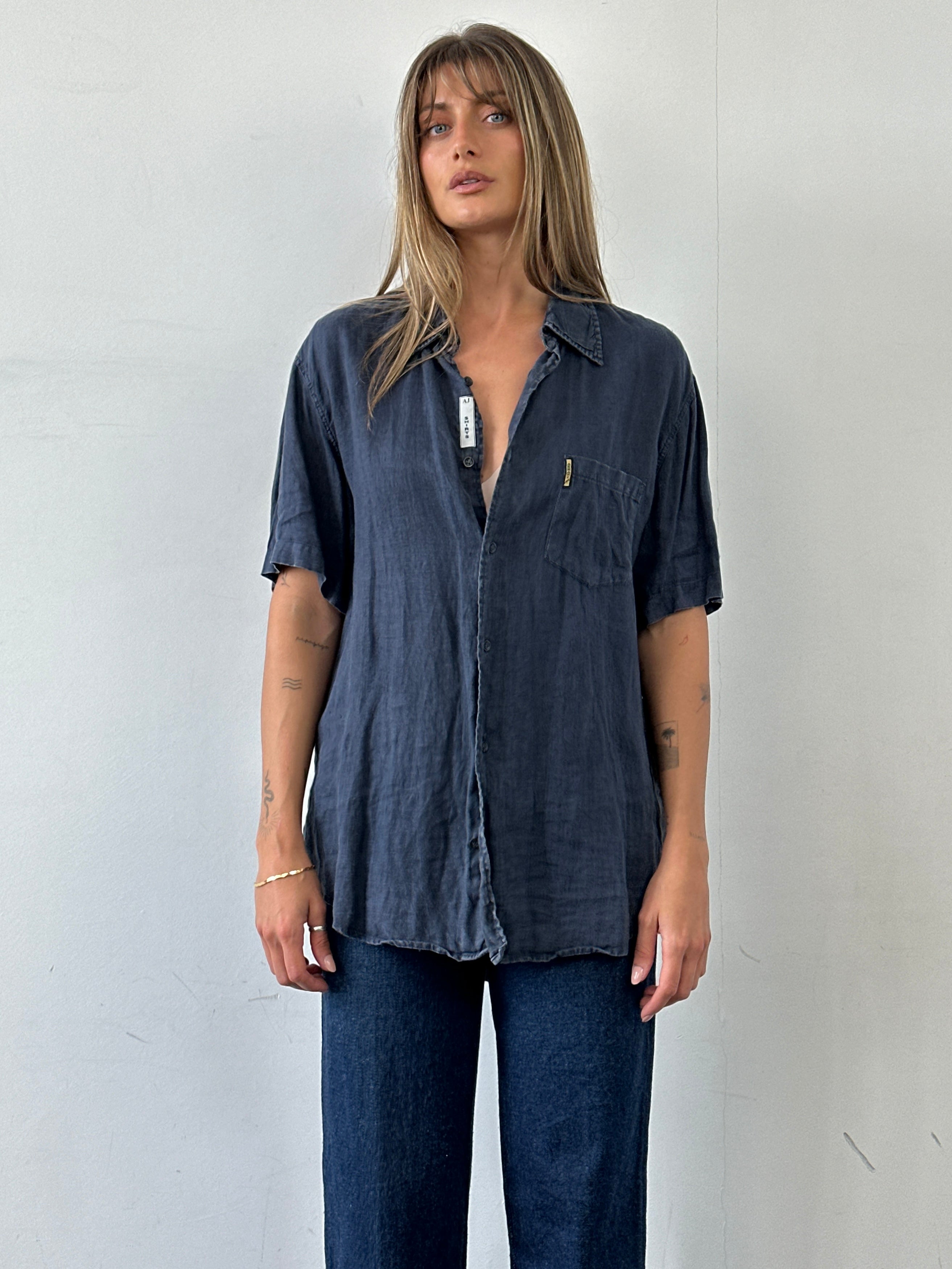 Armani Jeans pure linen short sleeve shirt in size L, lightweight fabric with a classic collar and button front.