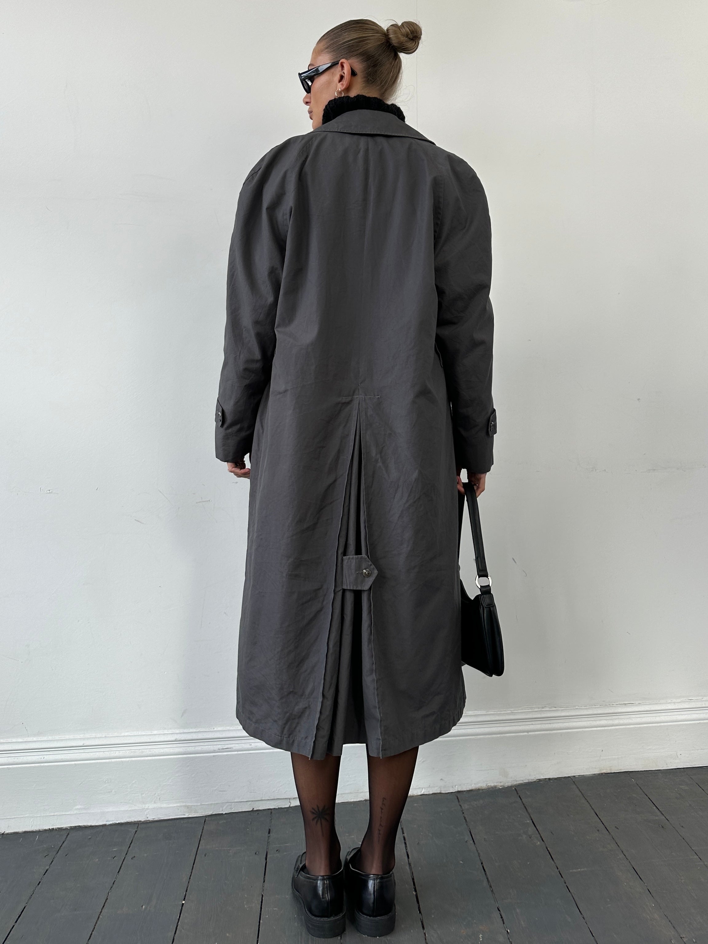 Christian Dior double-breasted trench coat in size L, tailored fit with classic design and stylish belt detail.