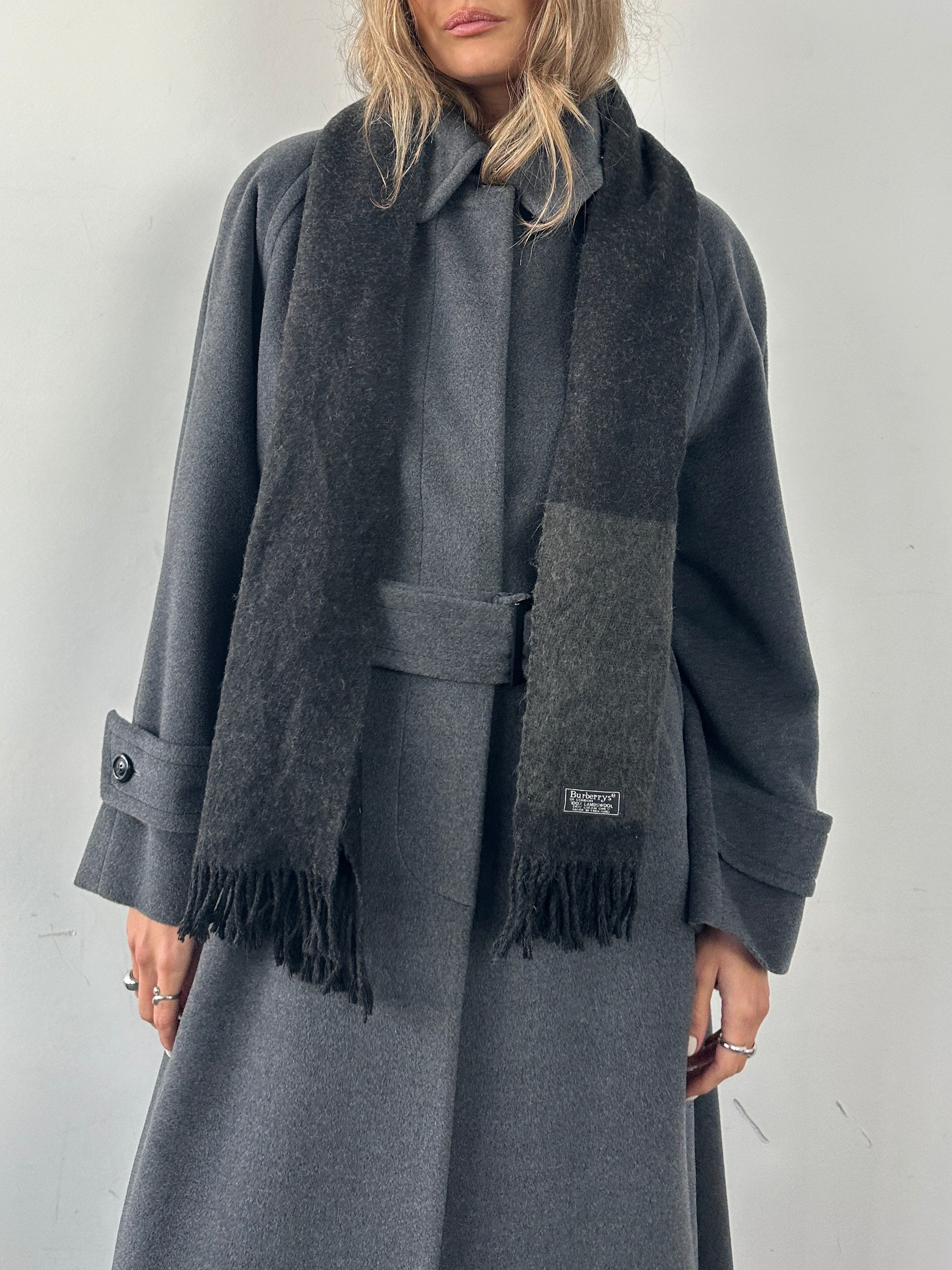 Burberry Pure Lambswool Logo Scarf featuring classic check pattern and fringed edges, made of soft, warm lambswool fabric.