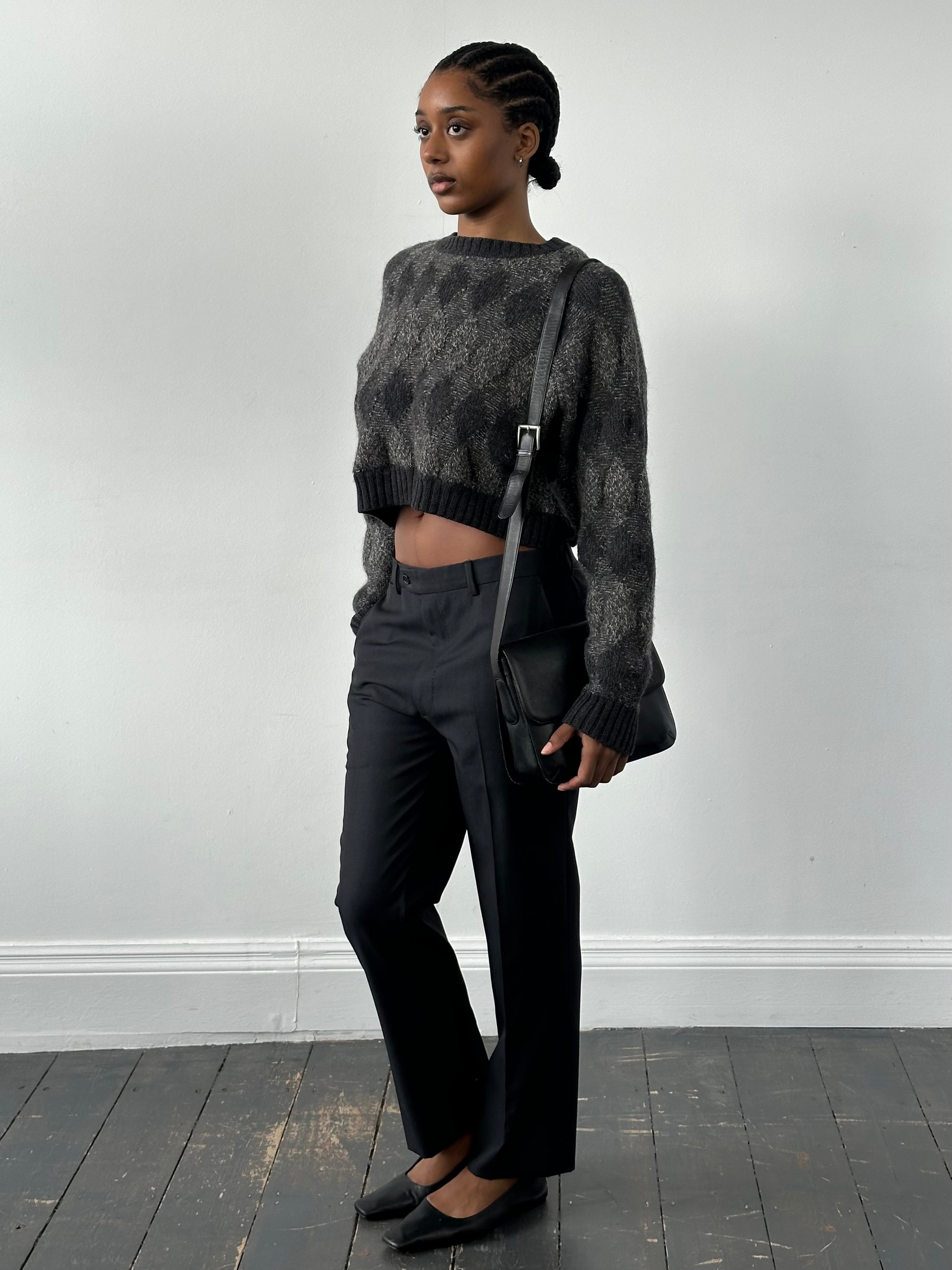 Valentino 1990s wool tailored trousers in W32, featuring a classic fit with a crease front and belt loops, displayed on a hanger.