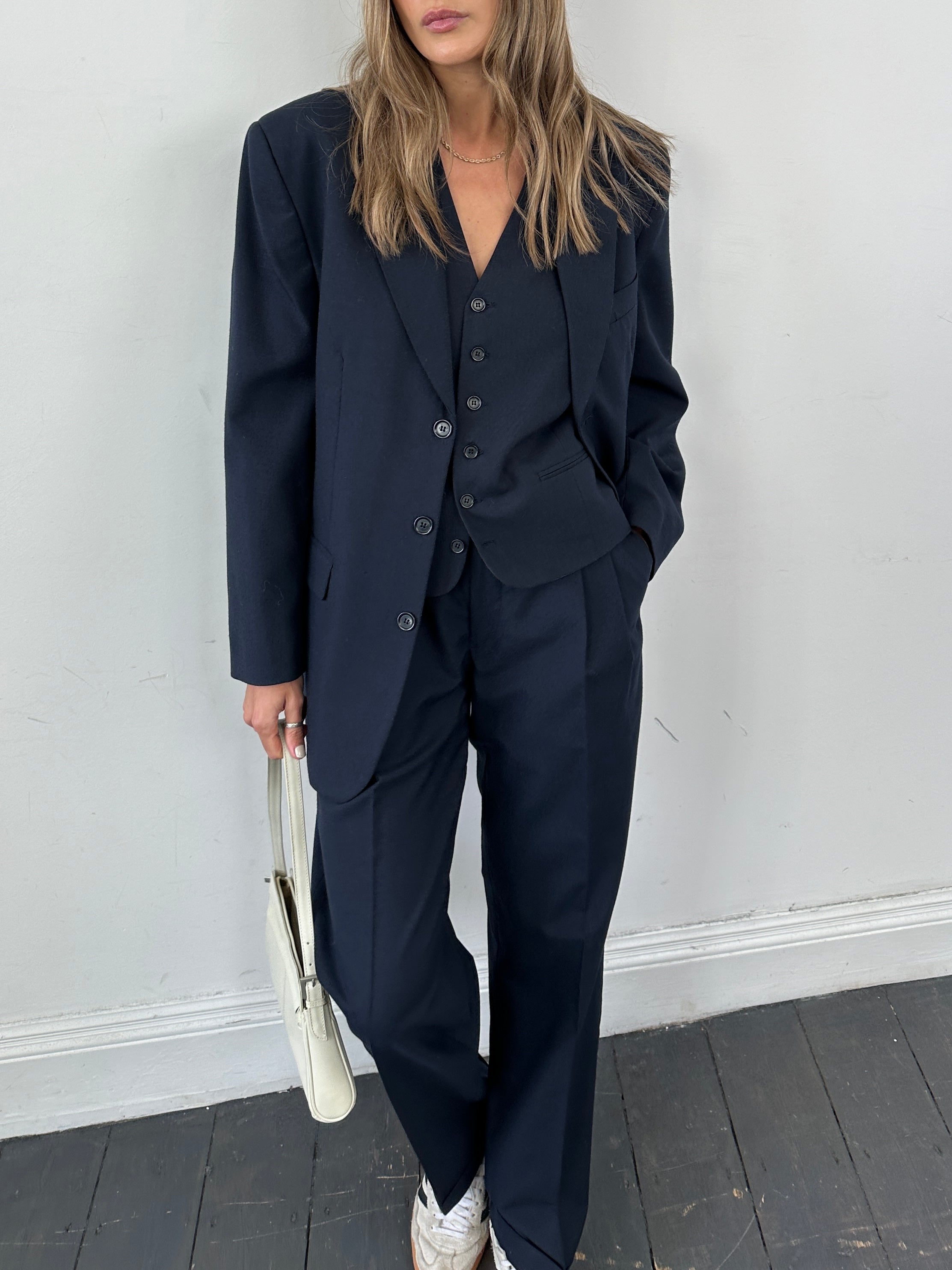 Vintage wool blend three-piece suit, single-breasted design, in size 38R/W30, featuring classic tailoring and structured fit.