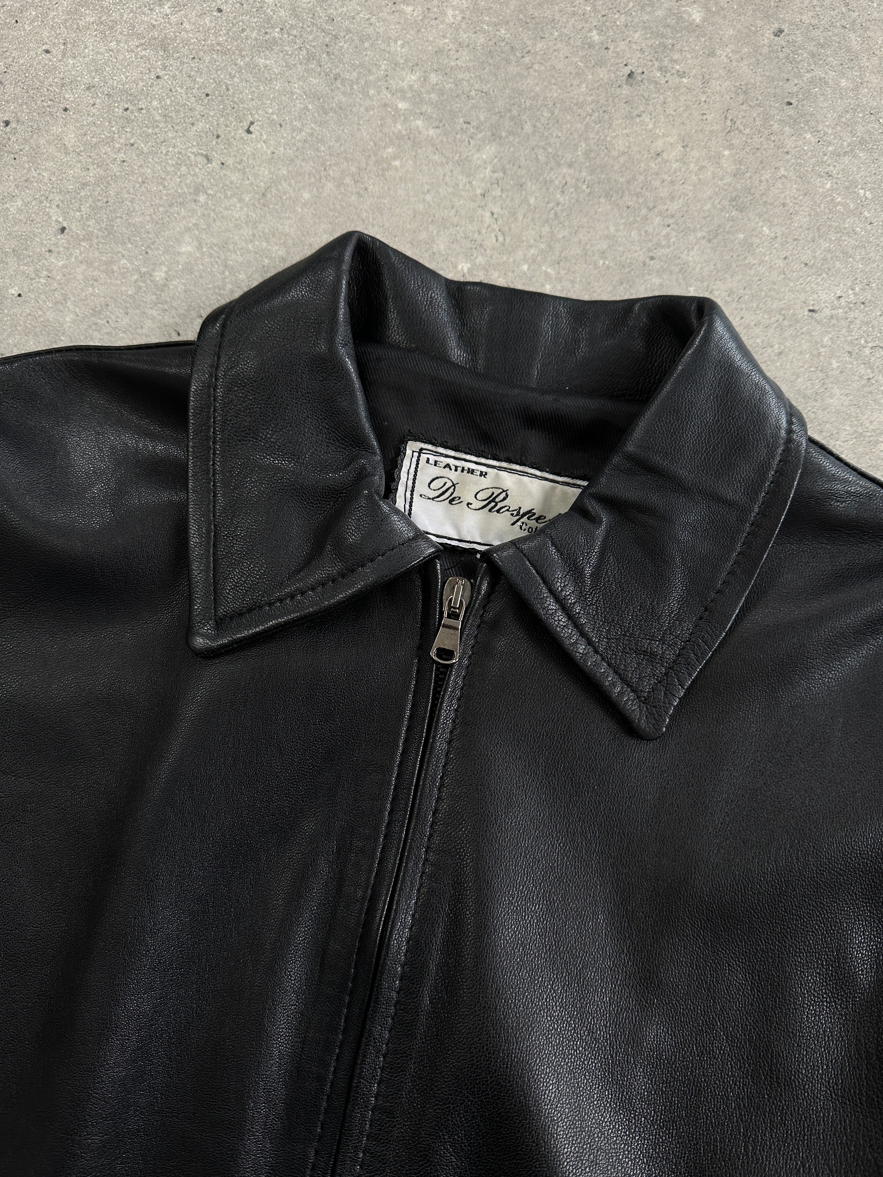 Vintage Italian vintage smooth leather double zip jacket in size M, featuring a classic design and sleek black finish.