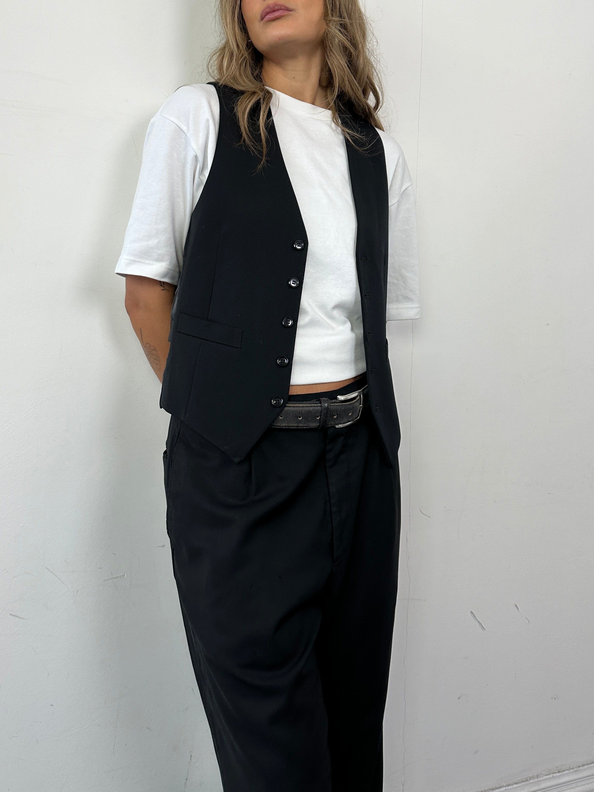 Vintage pure wool tailored waistcoat in size S, featuring classic design and fine craftsmanship, perfect for stylish layered outfits.