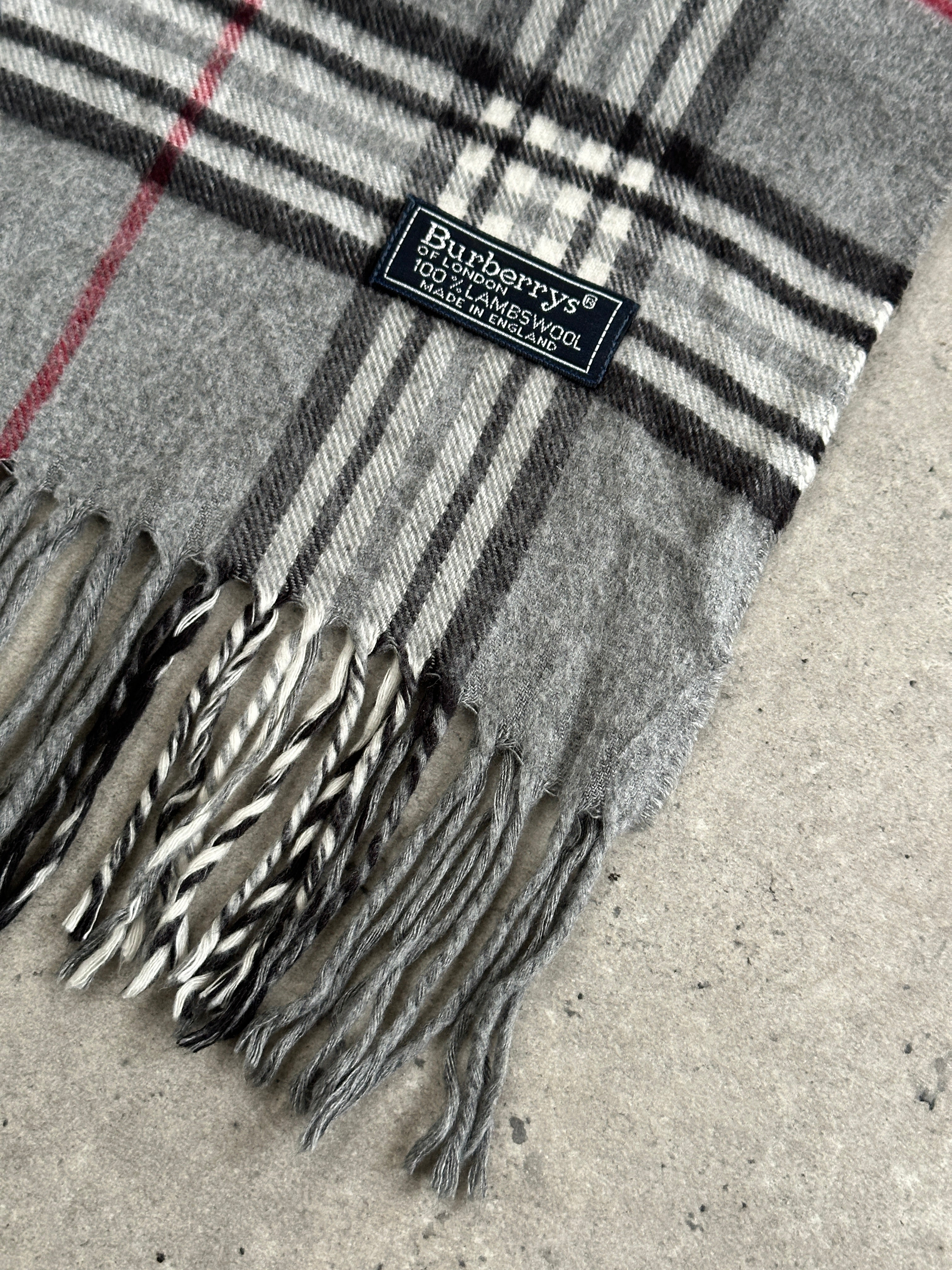 Burberry 1990s pure lambswool Nova Check scarf featuring classic plaid pattern in beige, black, red, and white.