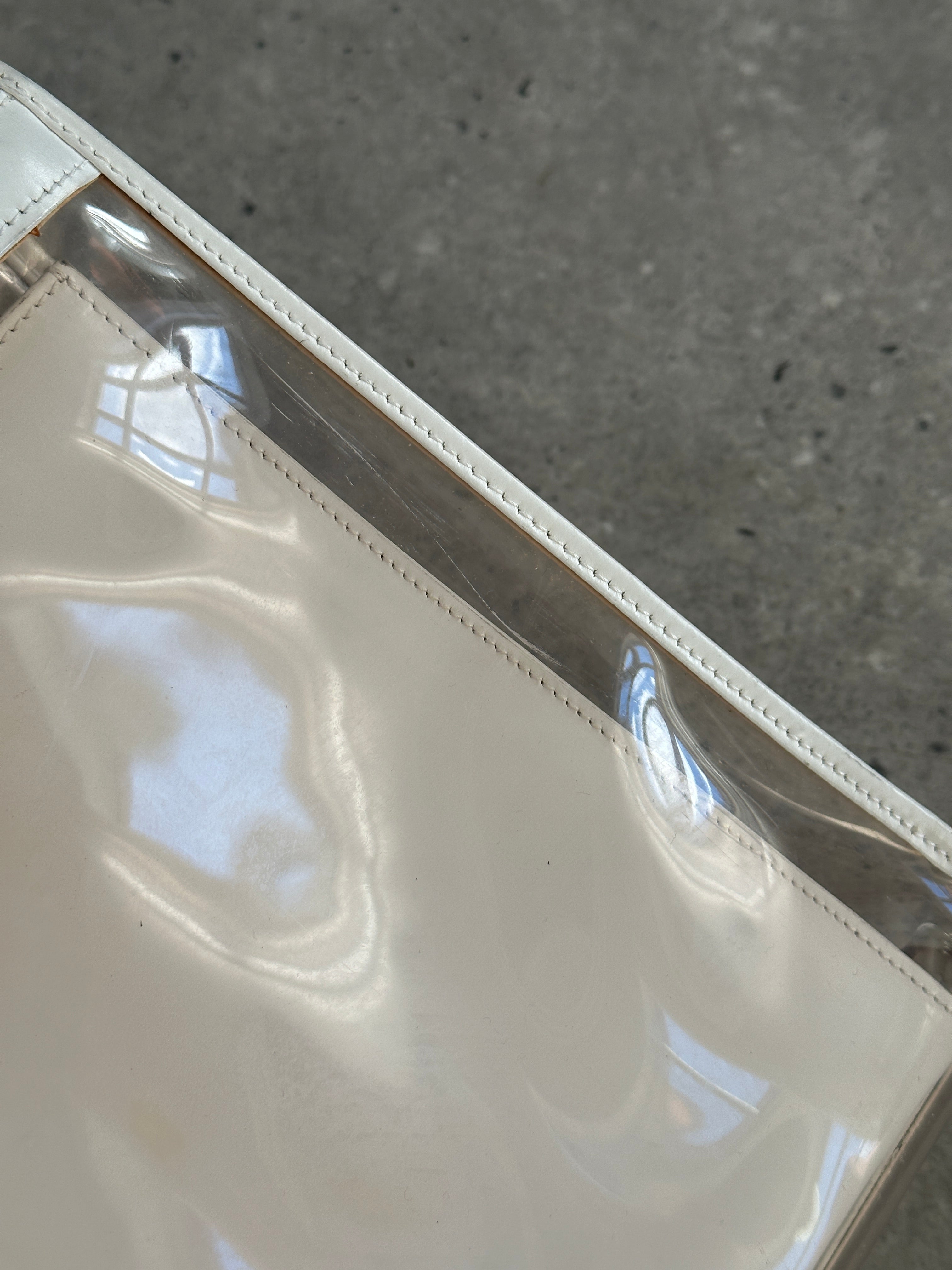 Gucci 1990s Tom Ford 2-in-1 leather and vinyl shoulder bag with adjustable strap and dual-tone design.
