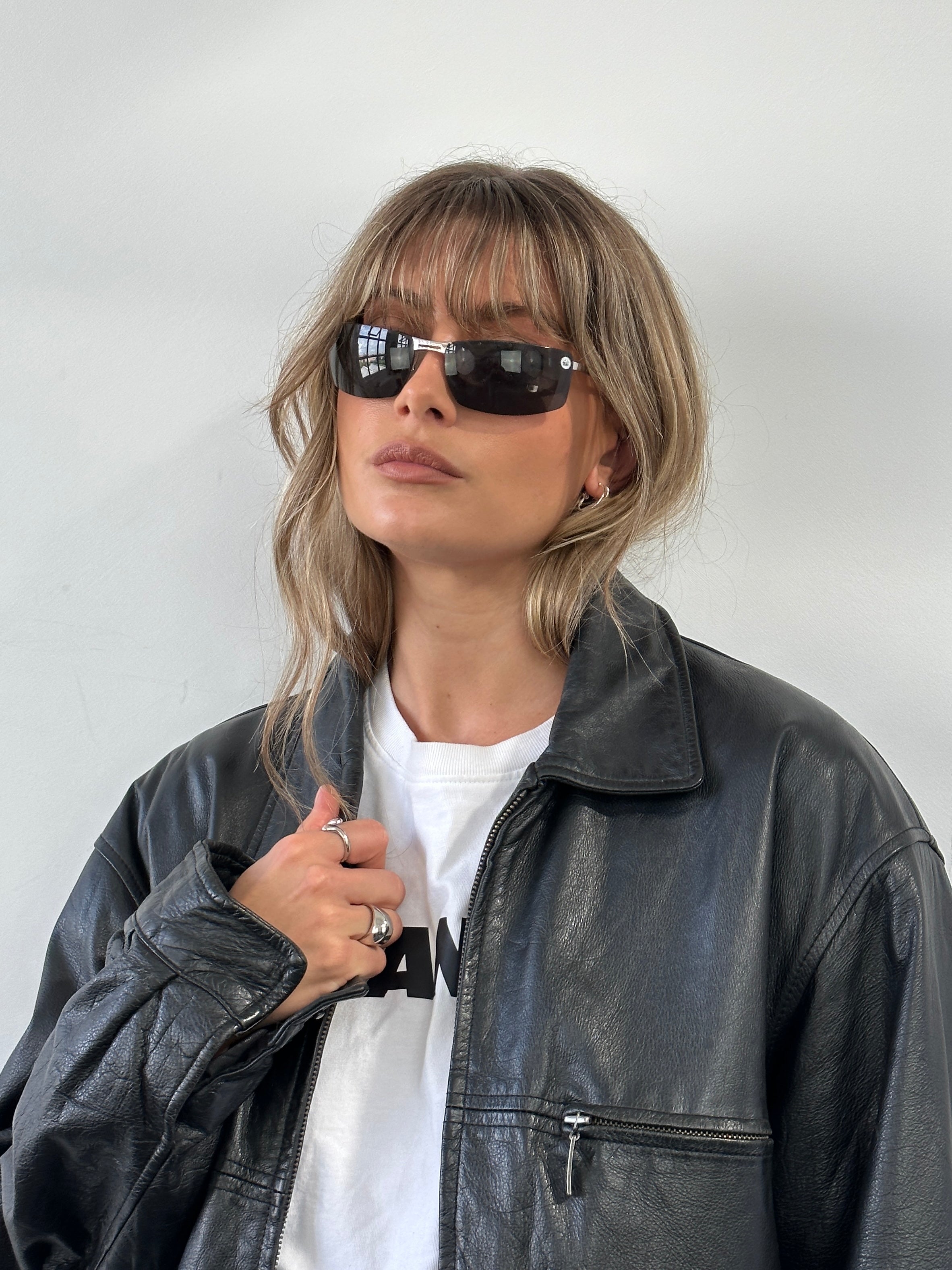 Christian Dior 2000s rimless sunglasses with sleek, modern design and transparent lenses, stylish eyewear by Christian Dior.