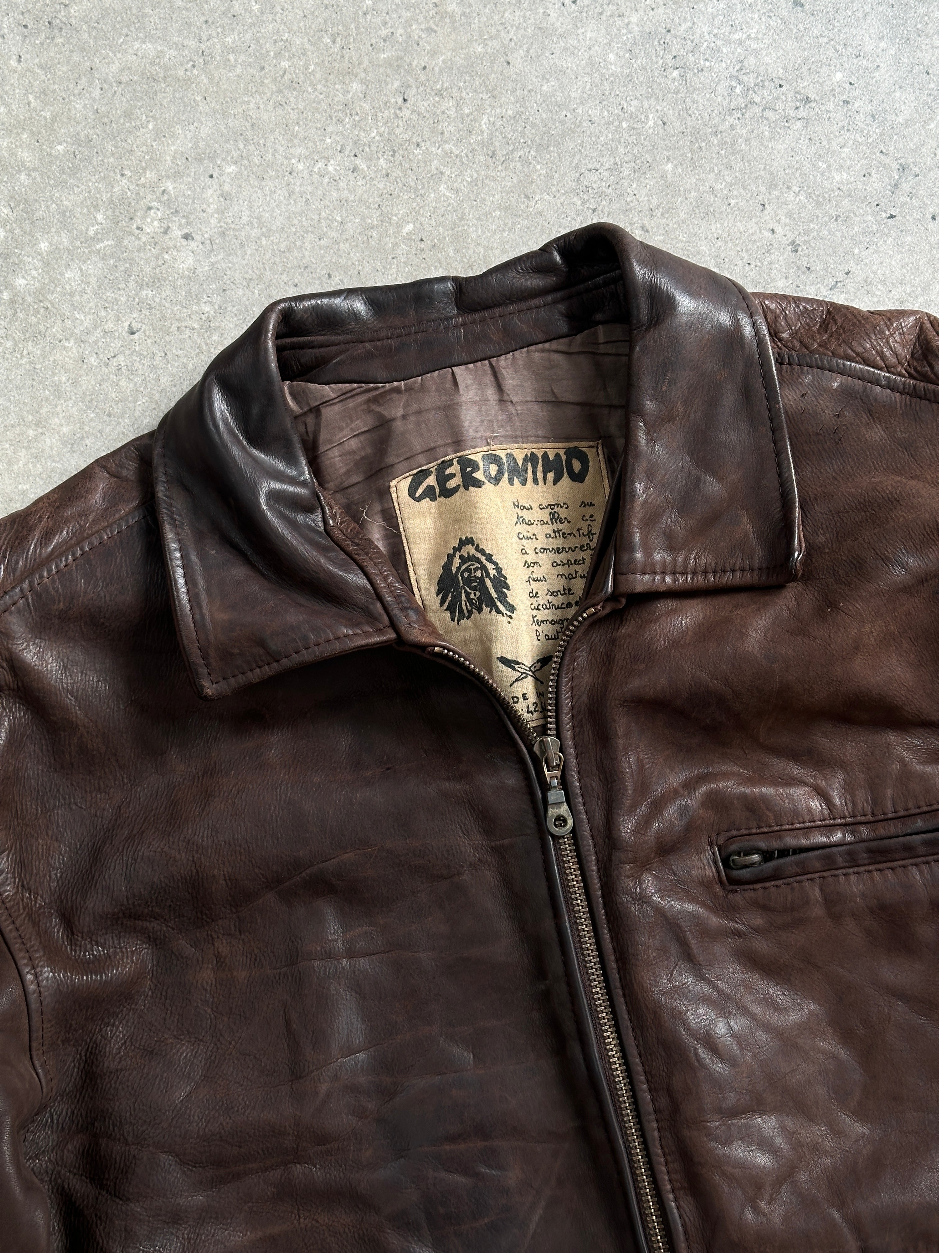 Vintage French 1980s aged boxy leather jacket, size large, with distressed brown leather and classic collar details.