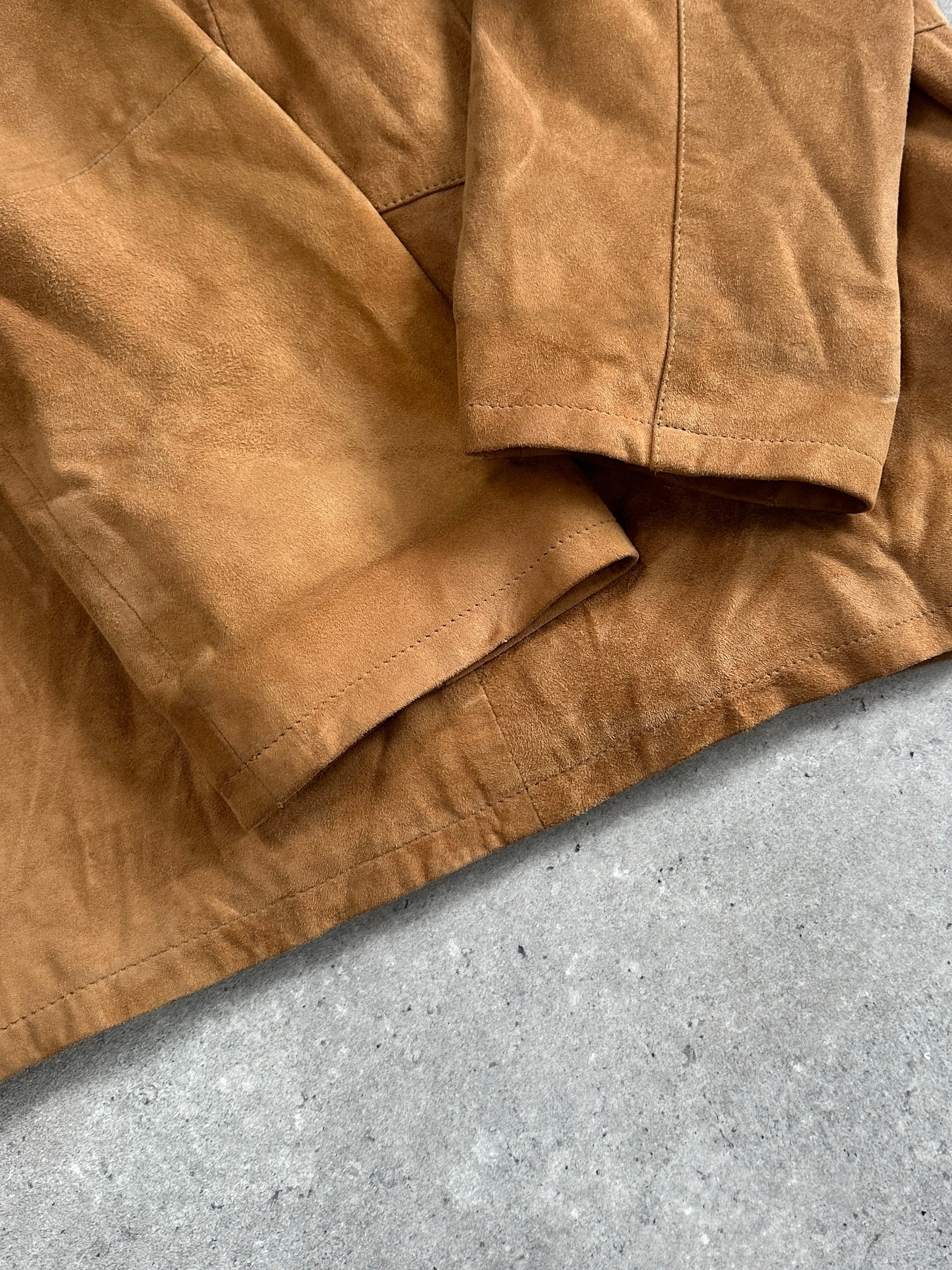 Vintage suede leather jacket in size M/L, showcasing classic style and textured material with a front zipper and collar.