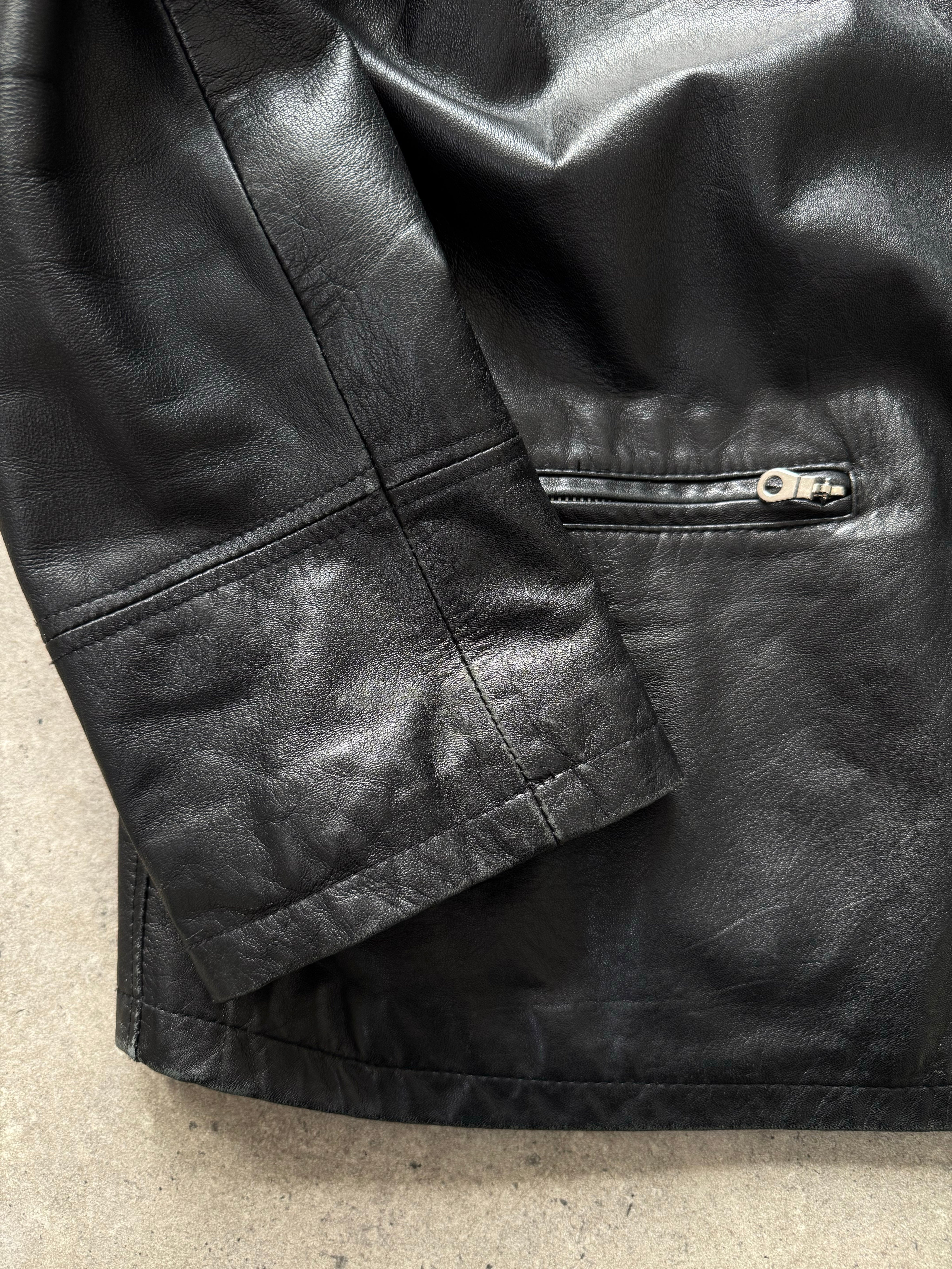 Vintage 1990s leather boxy jacket in brown leather, Italian vintage fashion, front view showing collar and button details.