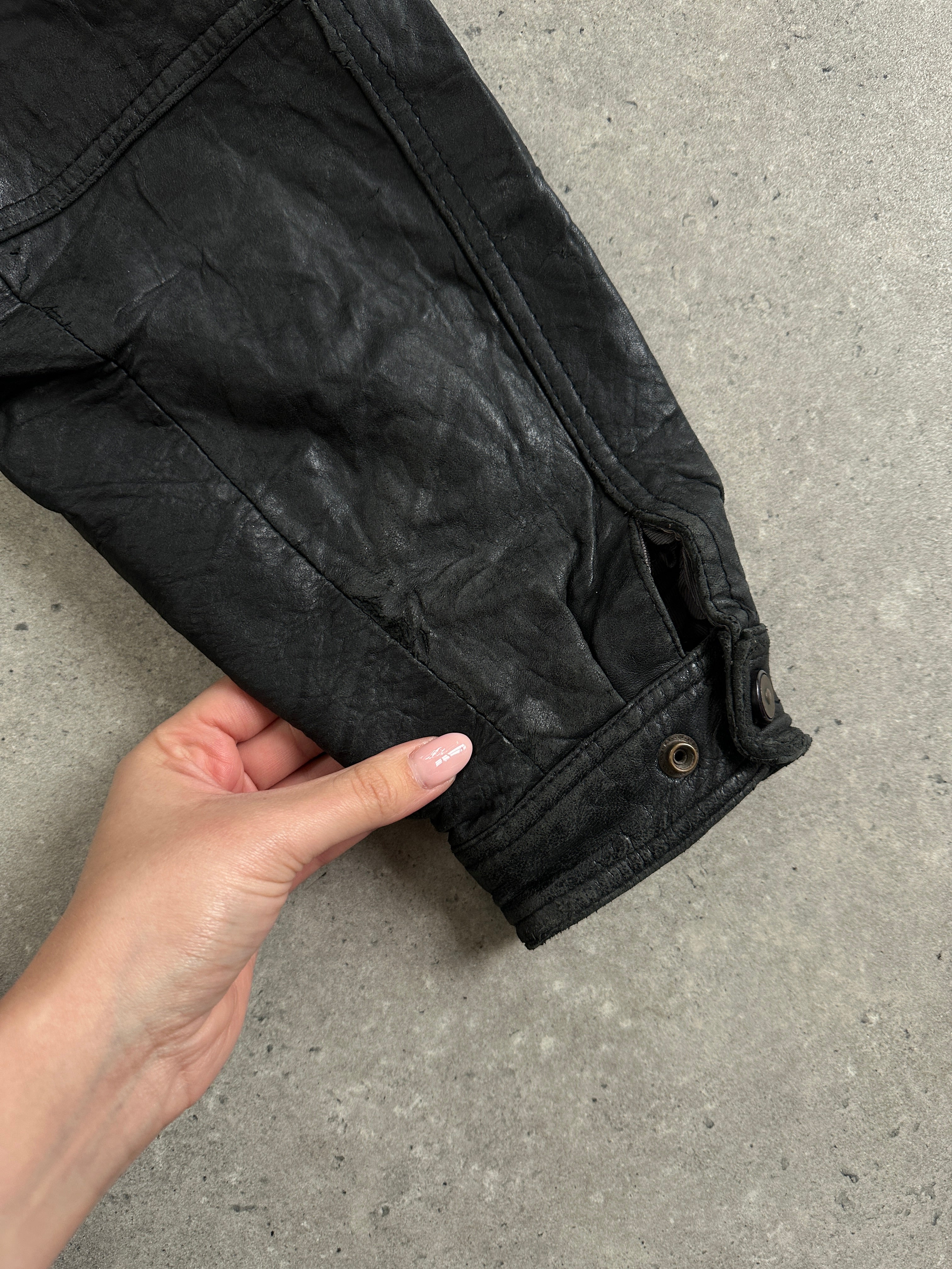 Vintage distressed leather bomber jacket in size large, featuring a classic design with a rugged, worn-in look.