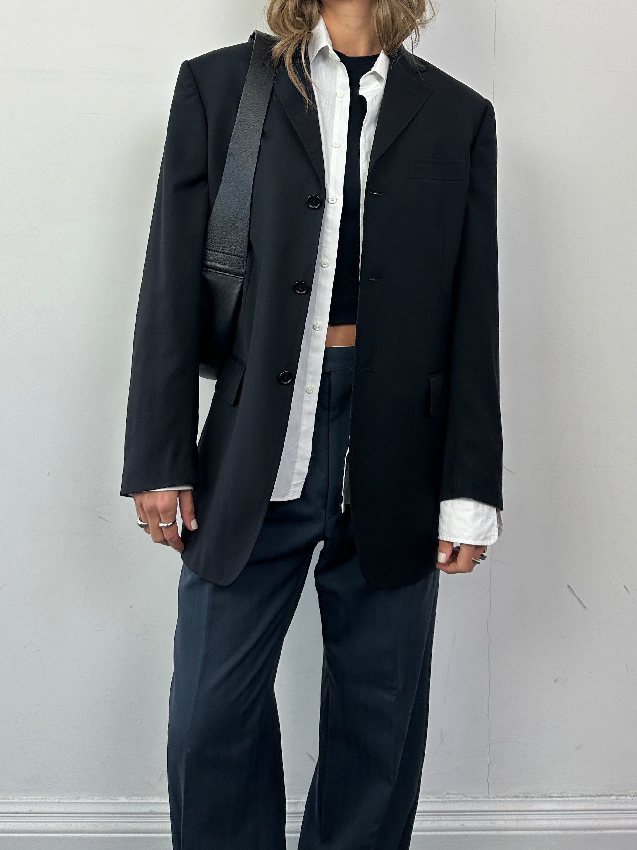 Dolce & Gabbana single-breasted virgin wool blazer in size M, tailored fit with classic lapels and button closure.