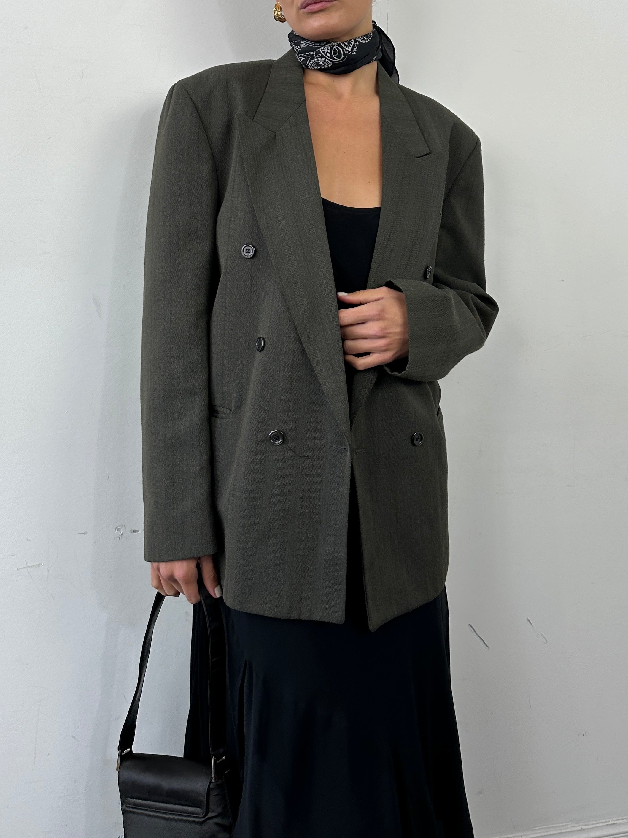 Vintage British double-breasted blazer in size 40R, tailored fit with classic style and textured fabric.