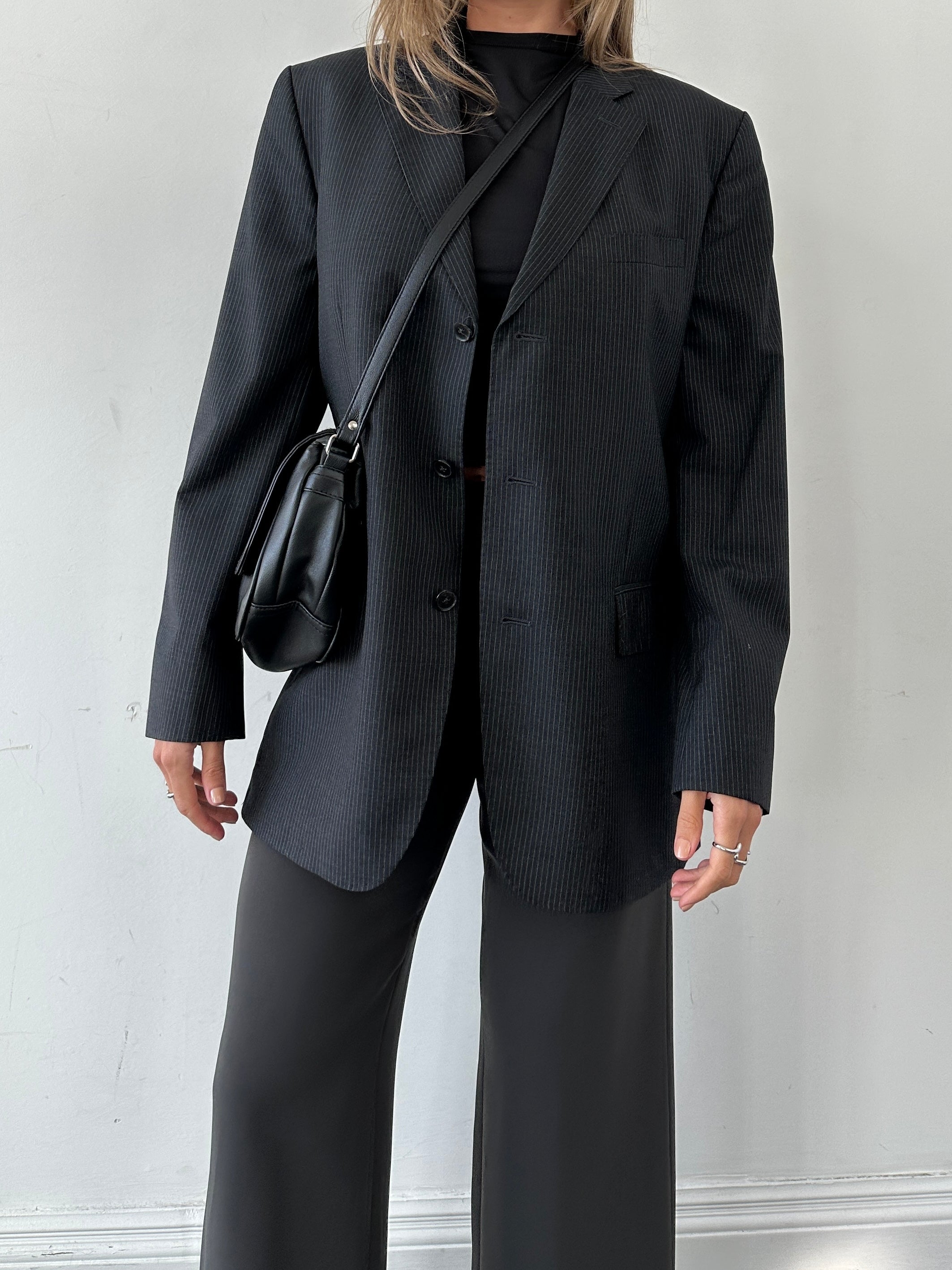 Jaeger pure wool pinstripe blazer in size 40R/M, tailored fit with classic pinstripe pattern and structured lapels.