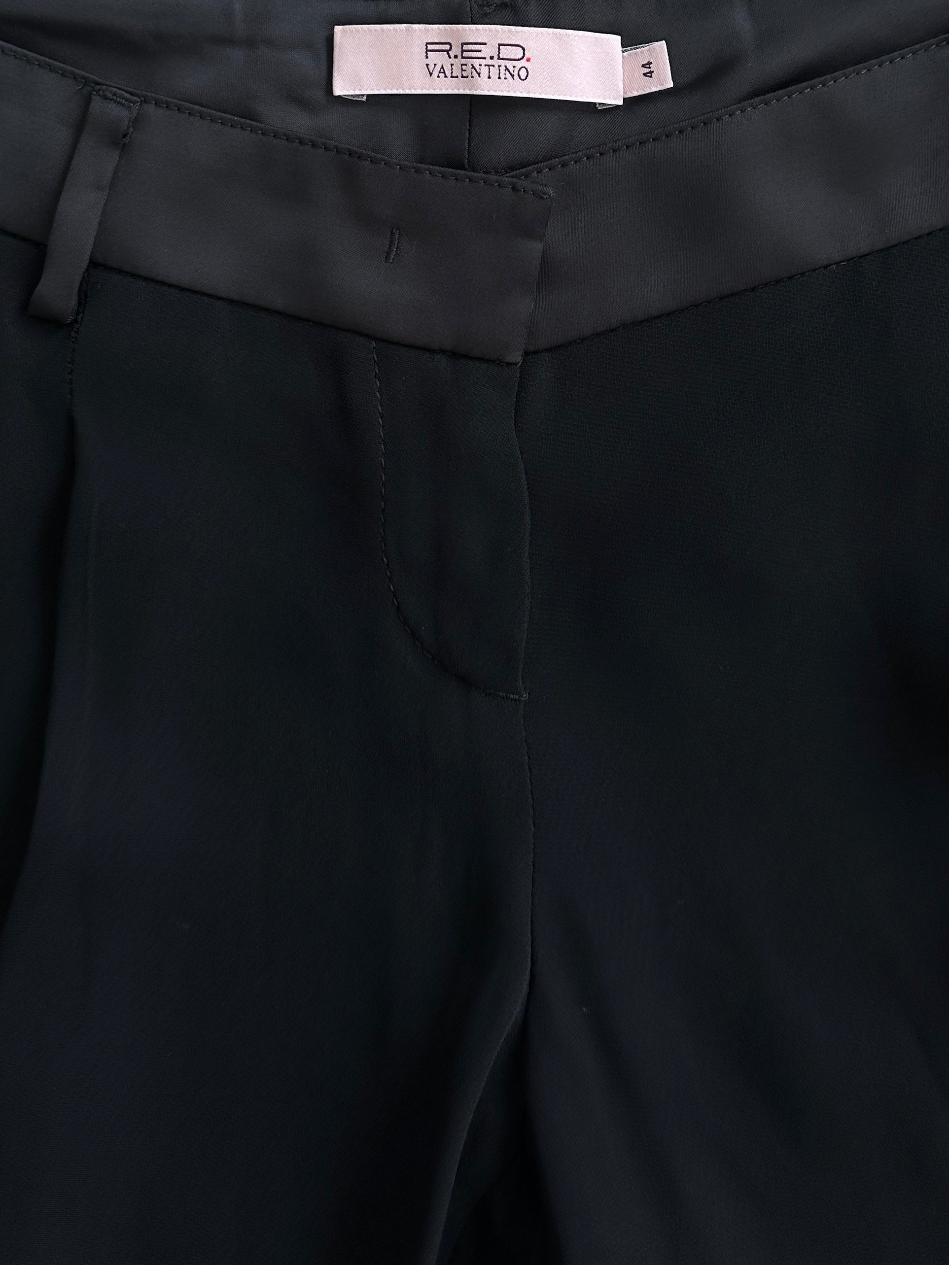 Valentino low waist wide-leg tuxedo trousers in black fabric, tailored fit, with wide legs and classic tuxedo style.