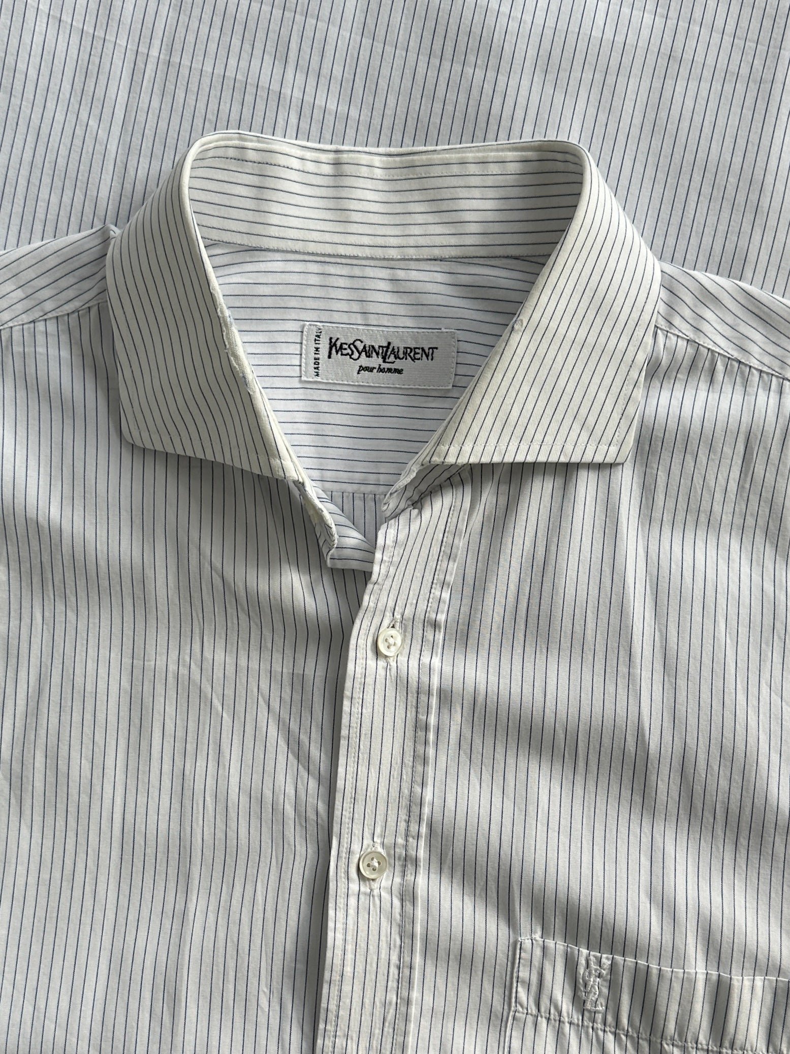 Yves Saint Laurent Pour Homme pinstripe cotton shirt in XL, shown flat with collar and long sleeves, stylish men's dress shirt.
