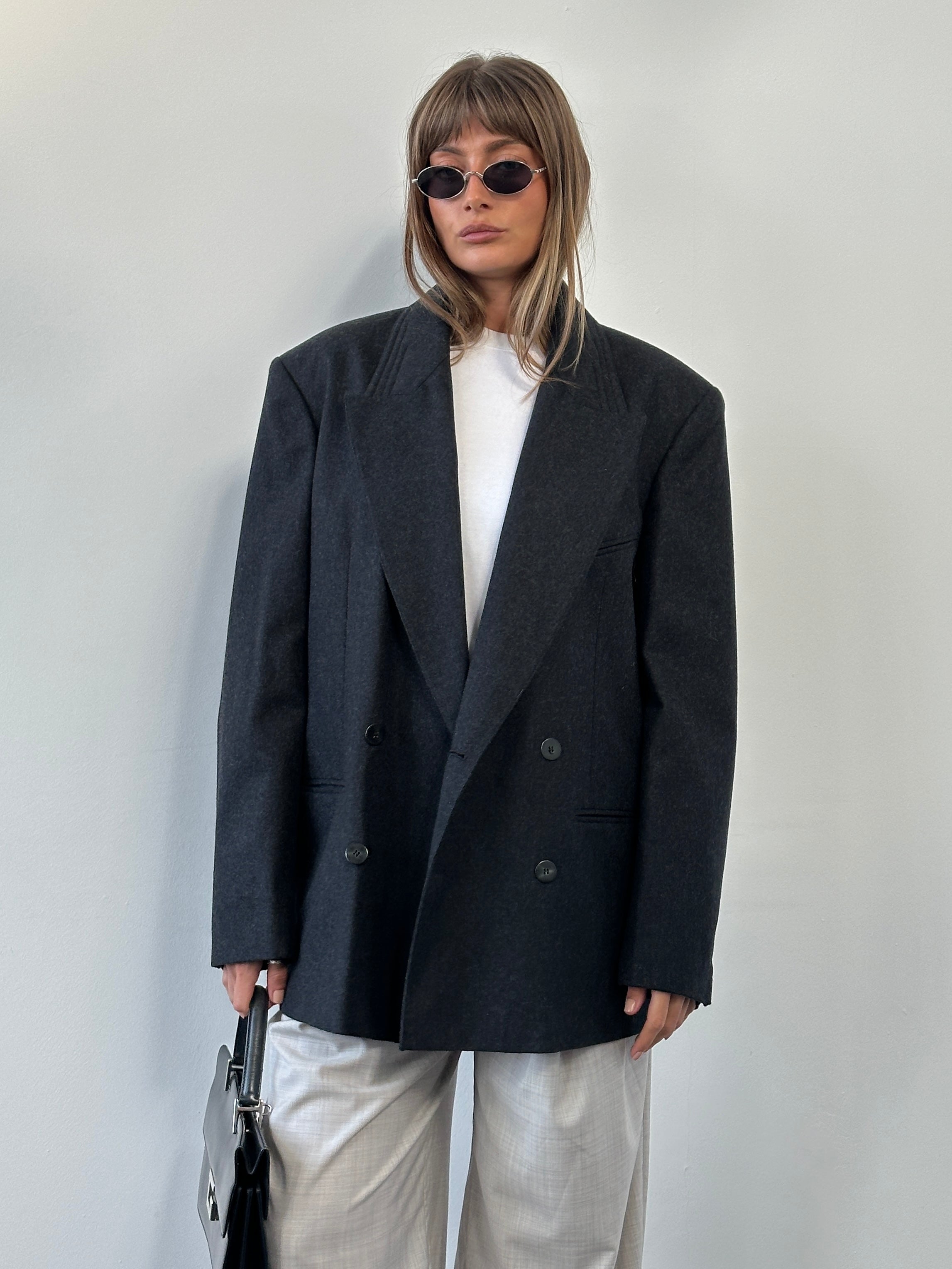 Vintage Italian double-breasted wool blazer in size 40R/XL, featuring classic tailoring and vintage style details.