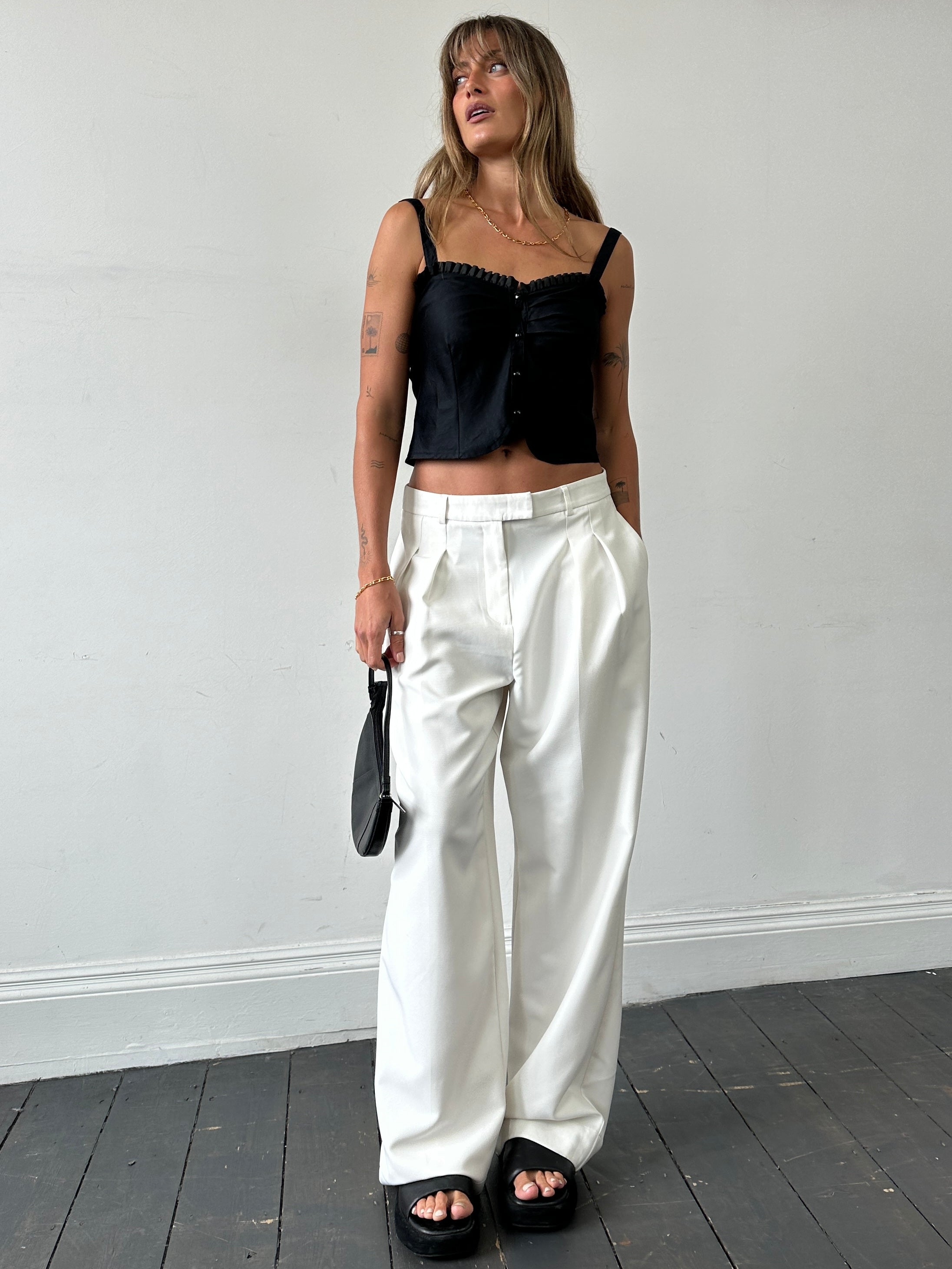 Vintage frill trim crop top in size S, featuring delicate ruffle details and a fitted design, perfect for casual or trendy outfits.