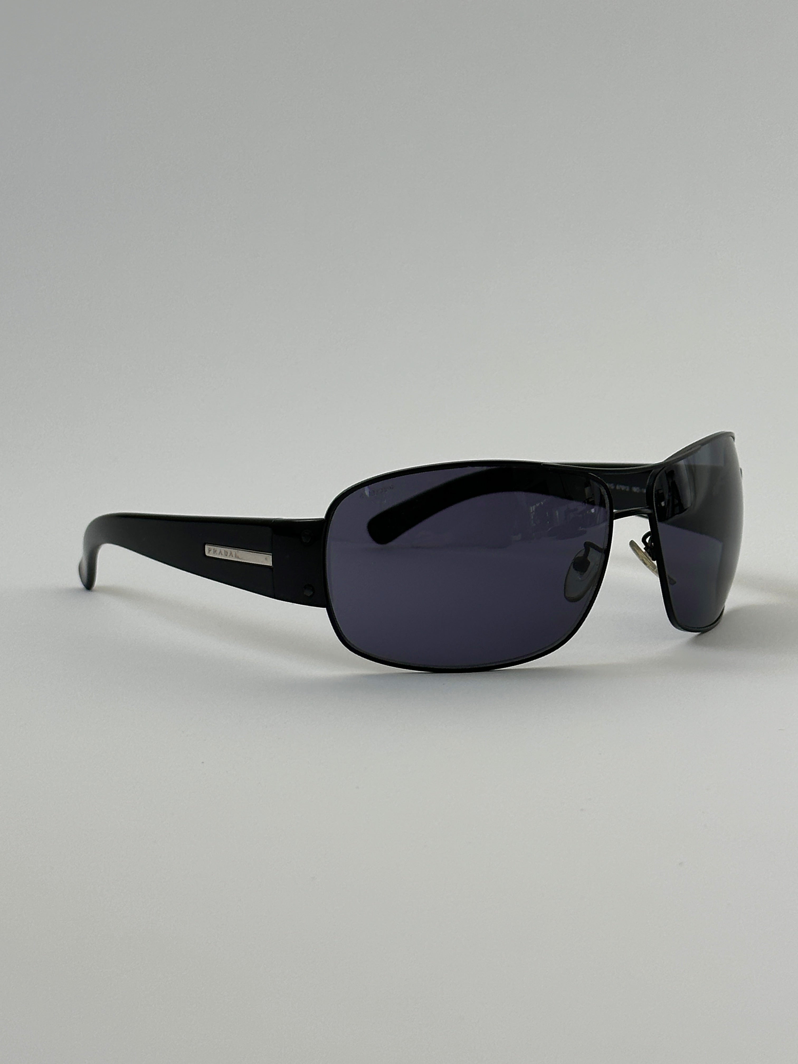 Prada aviator shield sunglasses with dark tinted lenses and metal frame, stylish eyewear for sun protection