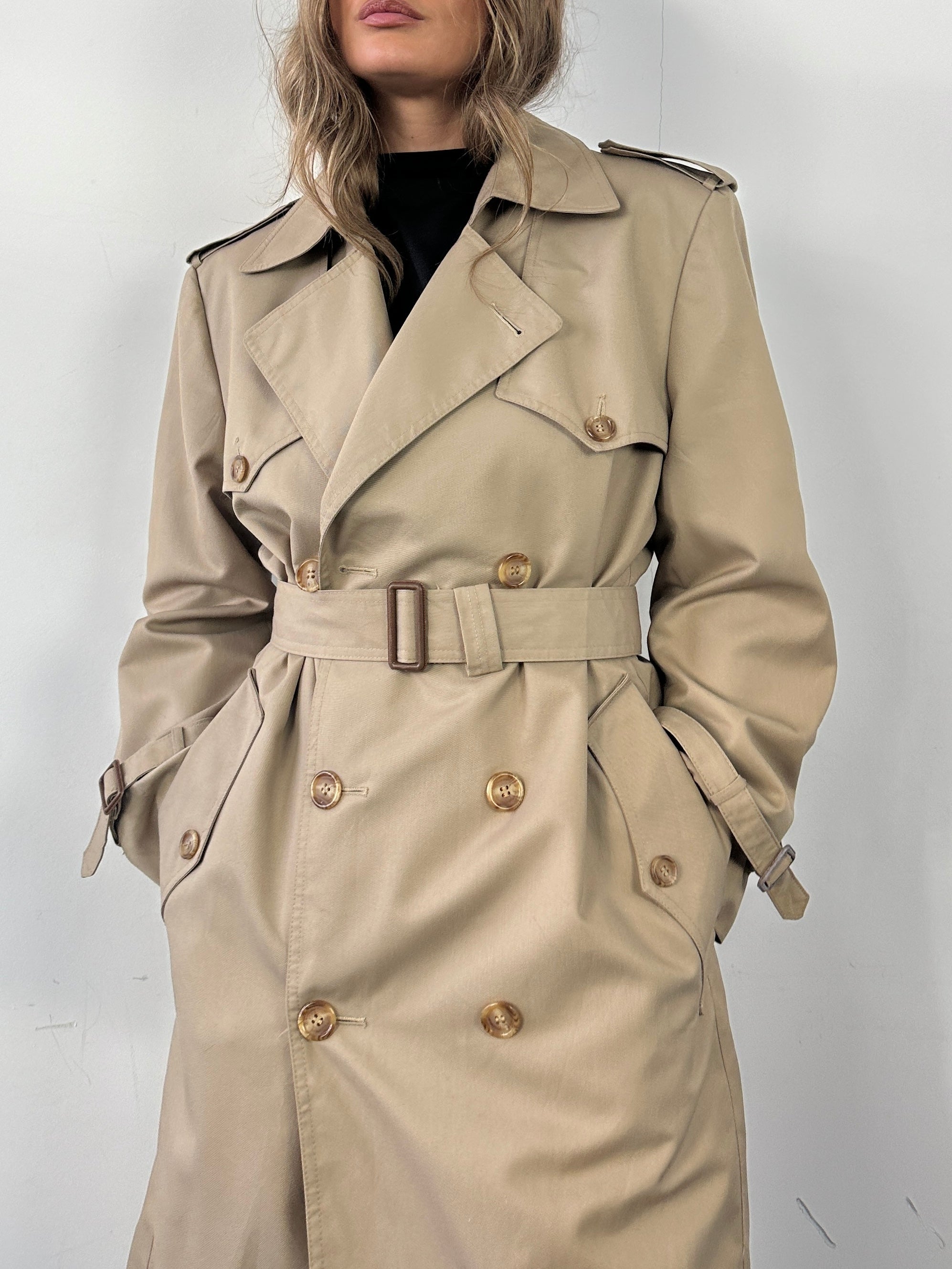 Christian Dior double-breasted cotton belted trench coat displayed on a model, showcasing classic style and tailored fit.