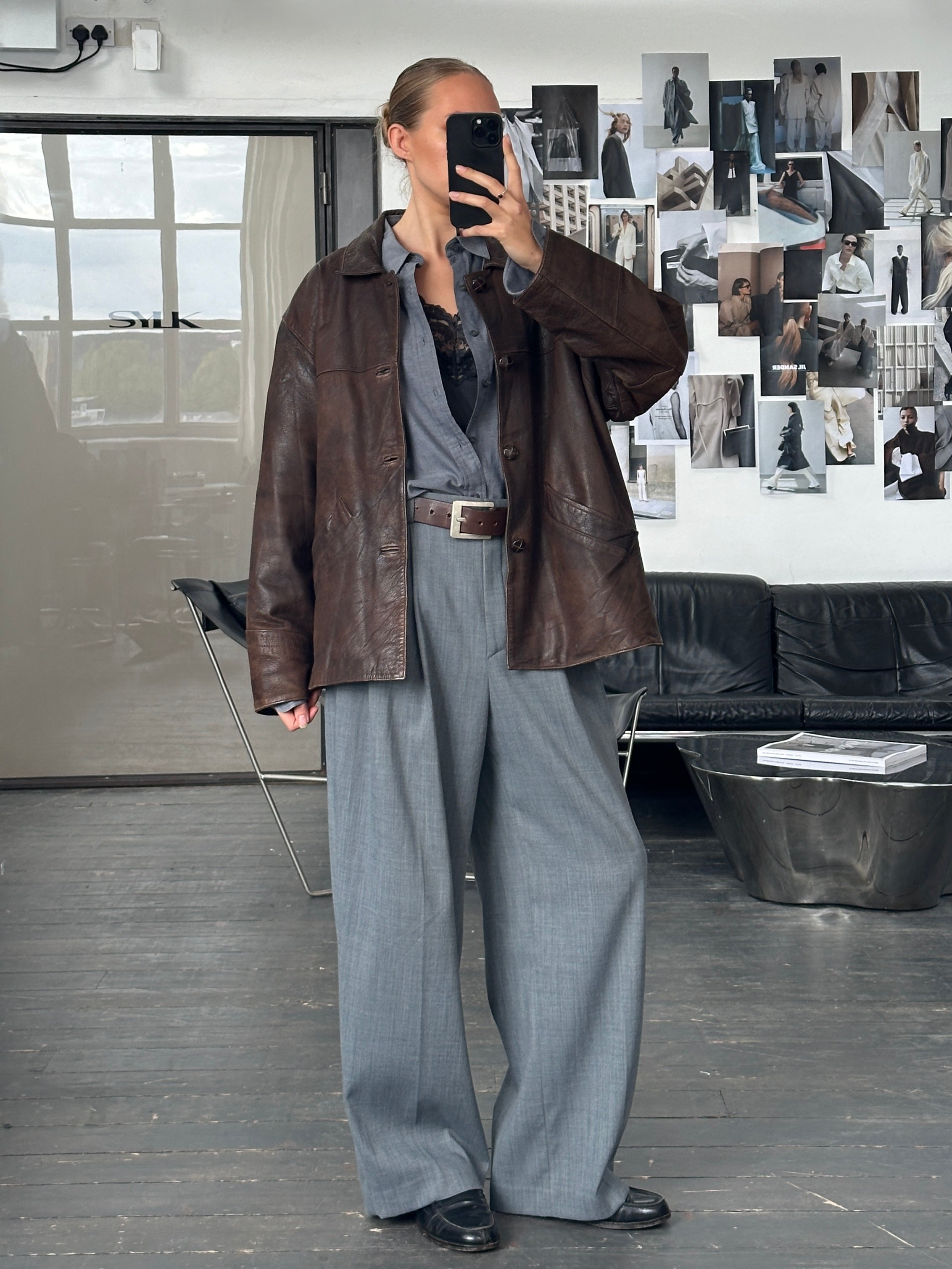 Vintage brand vintage 1980s aged boxy leather jacket in XL size, featuring distressed leather and a classic retro style.