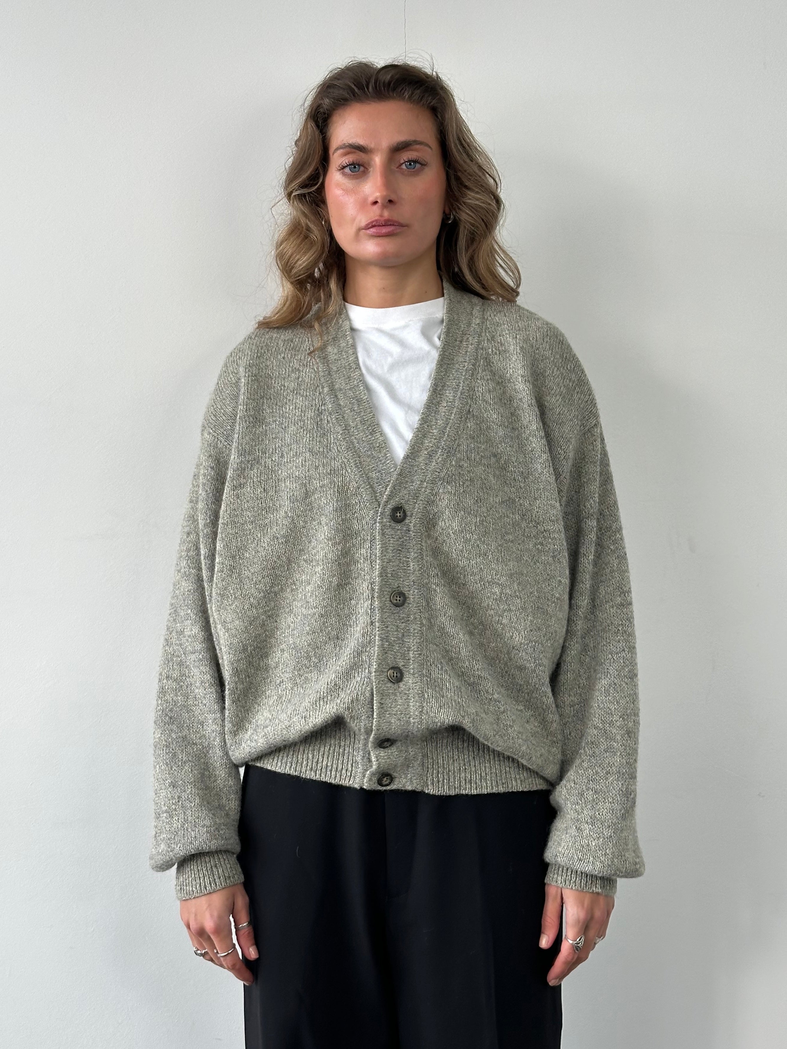 Emanuel Ungaro XL pure wool knitted cardigan with button closure, featuring a textured pattern and ribbed cuffs and hem.
