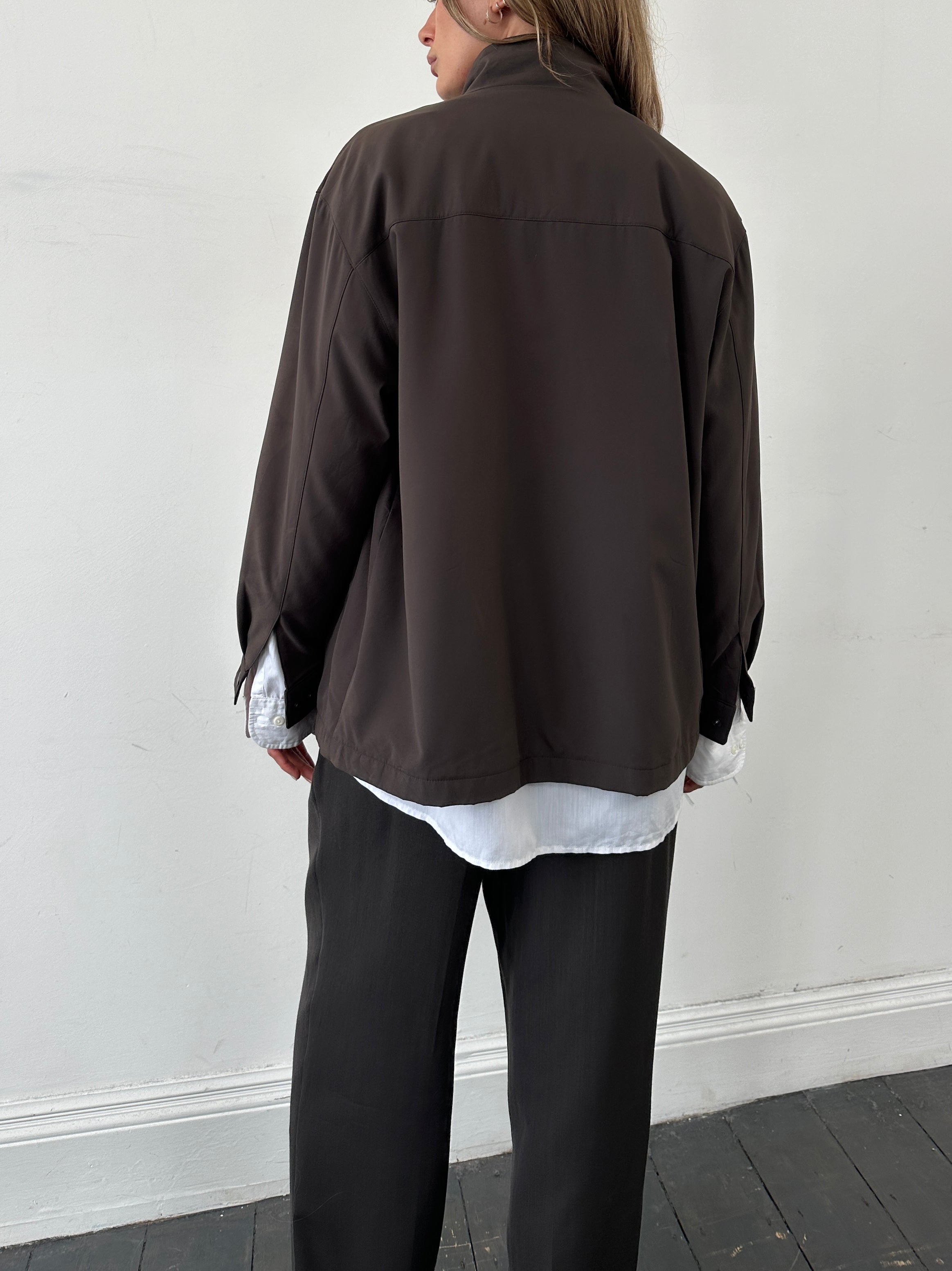 Yves Saint Laurent Pour Homme logo bomber jacket in black, front view showing the YSL branding and stylish design.
