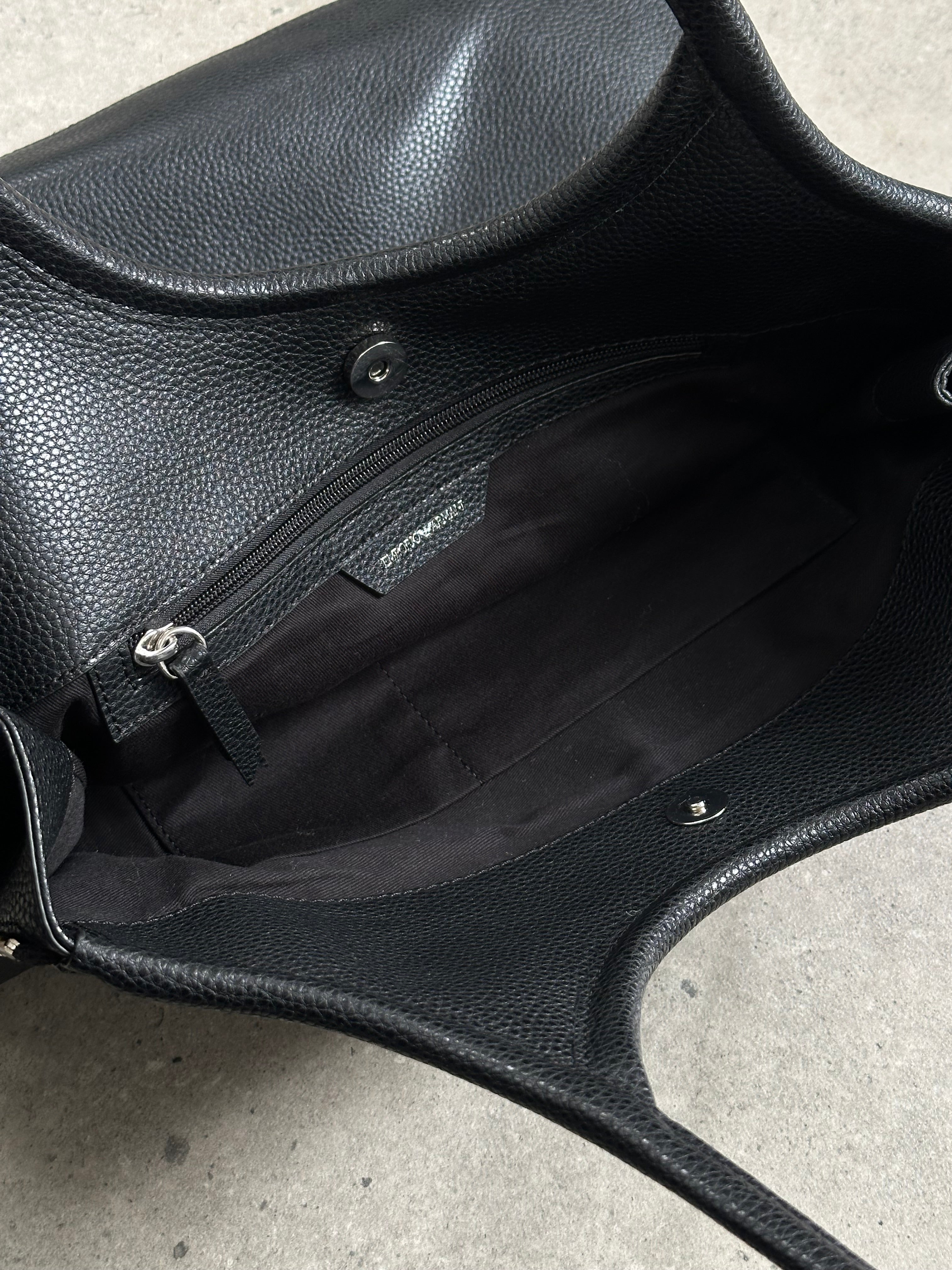 Emporio Armani 1990s leather shoulder bag with sleek design and subtle branding, featuring a classic shoulder strap and textured finish.