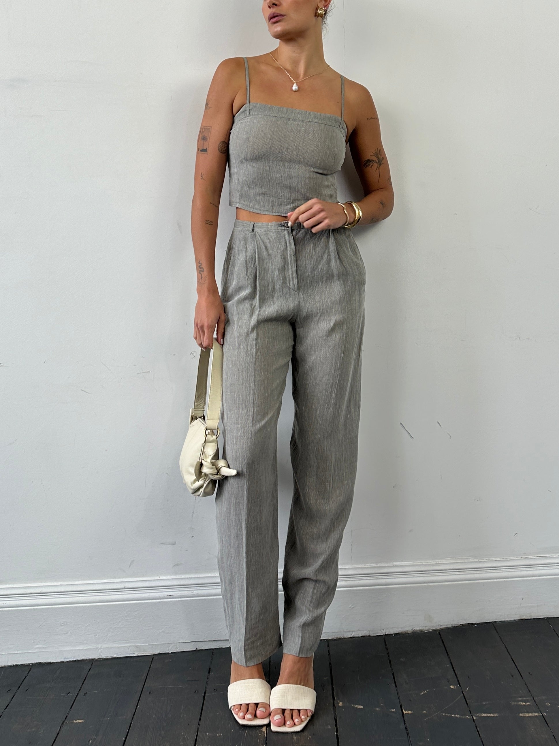 Mani Linen two-piece top and trouser co-ord set in light fabric, featuring a stylish matching top and trousers for a casual look.