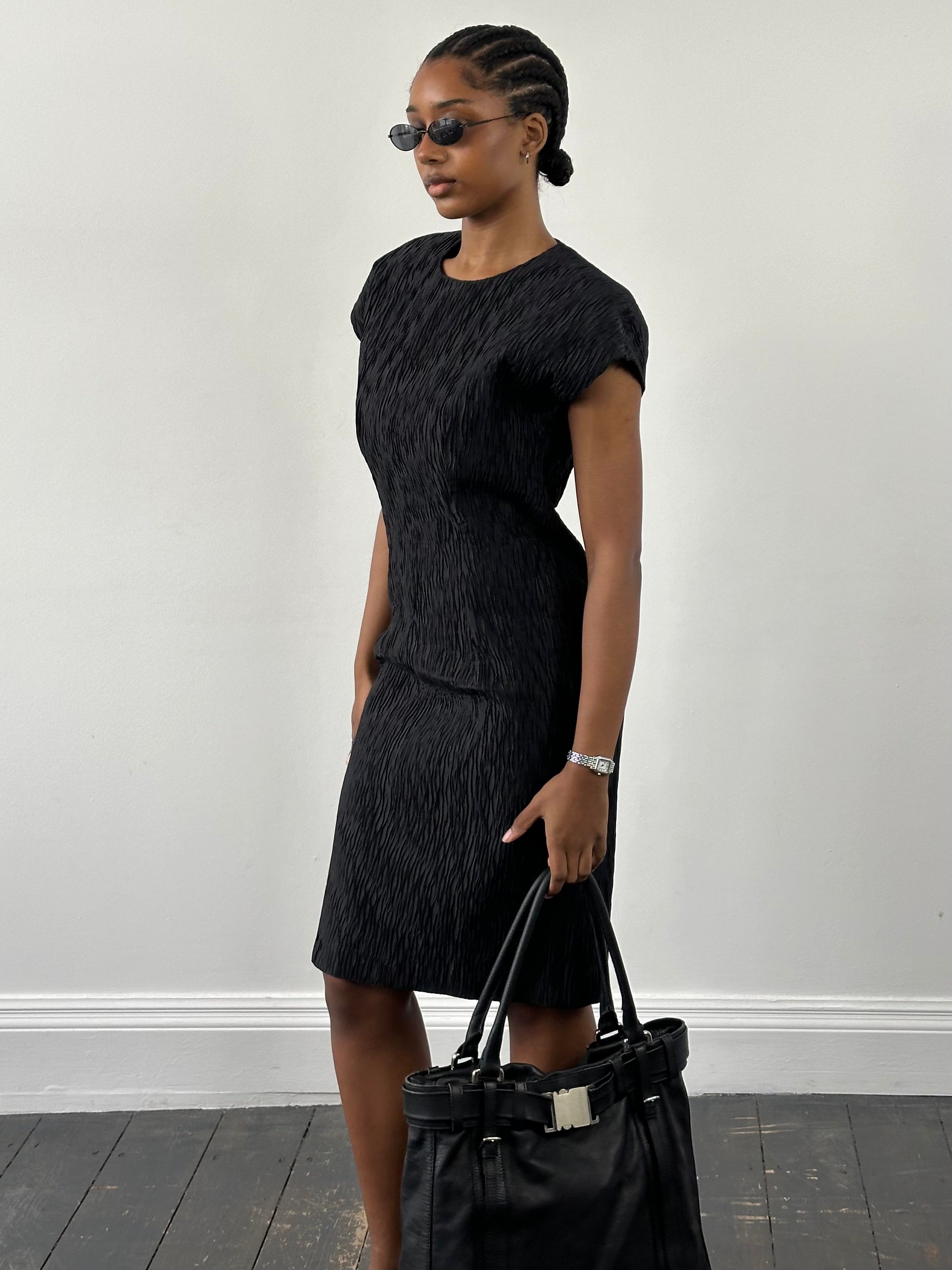 Vintage Italian vintage pleated sleeveless midi dress in S/M, featuring classic pleats and elegant design.
