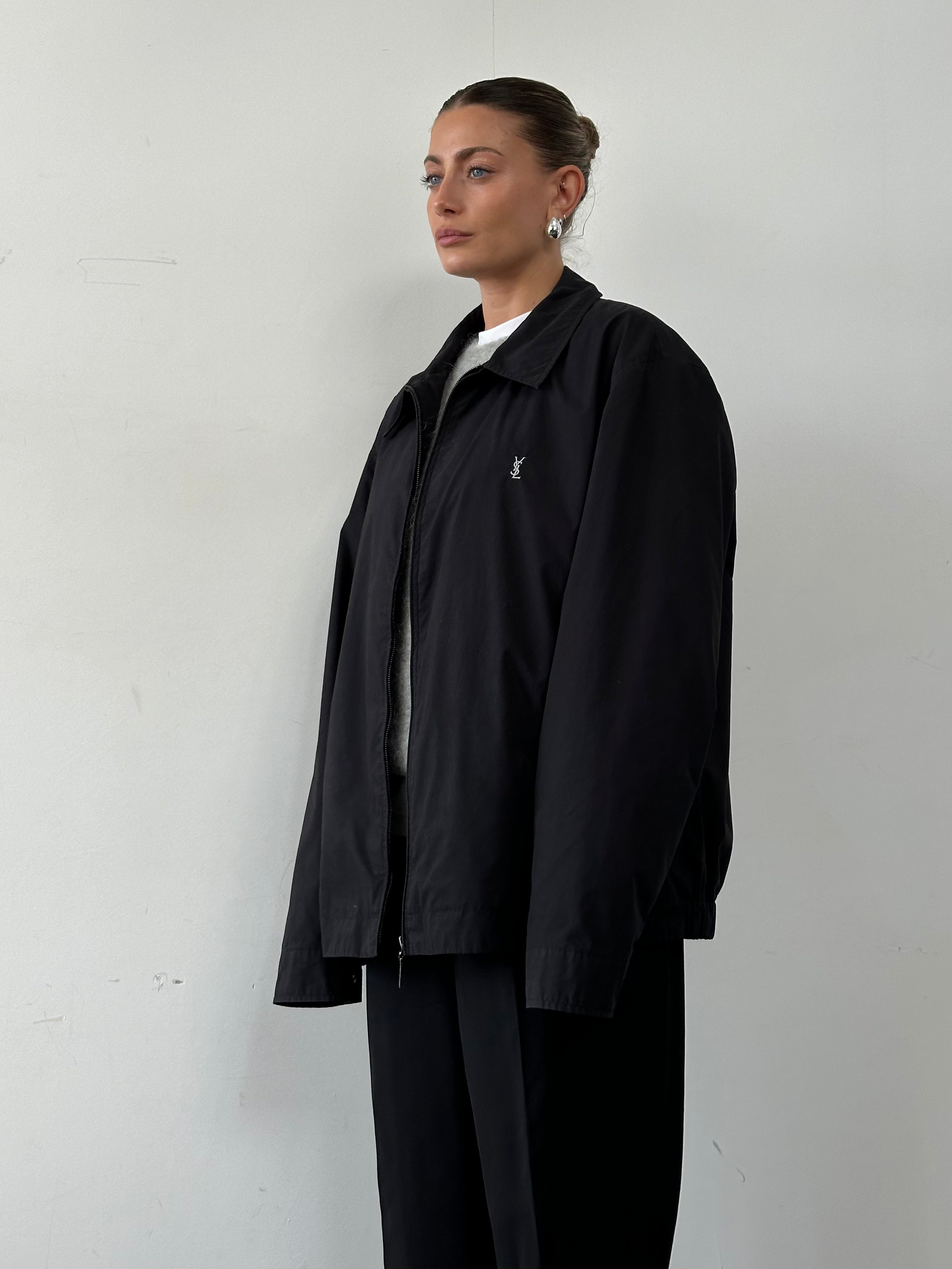 Yves Saint Laurent Pour Homme logo bomber jacket in XXL, black with embroidered logo, front zipper, and ribbed cuffs.