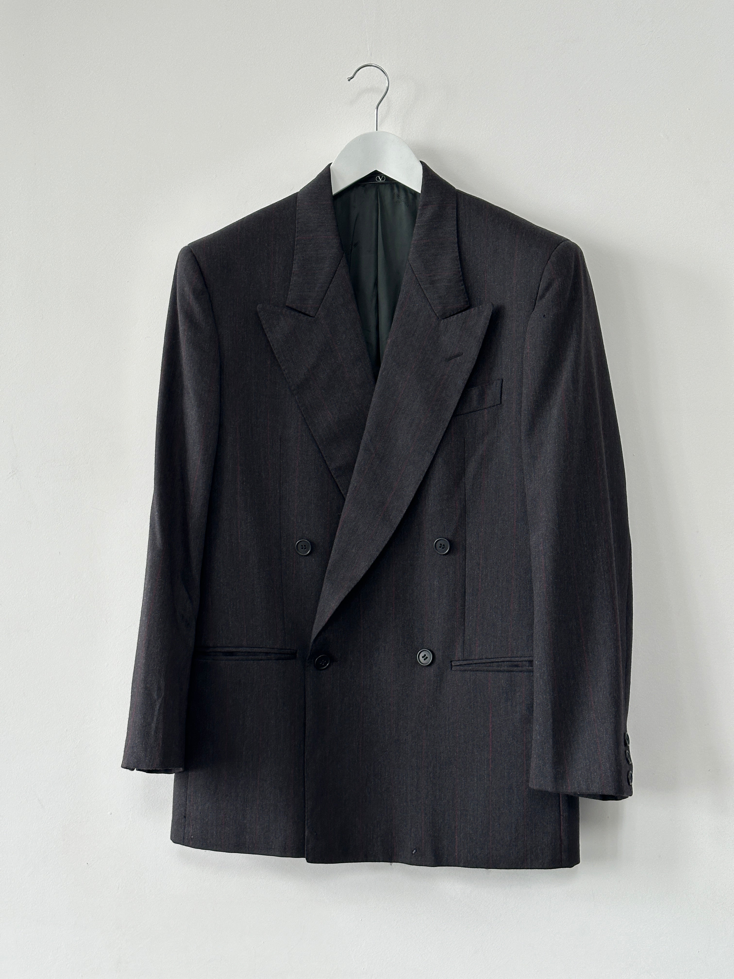 Valentino virgin wool double-breasted blazer in navy, tailored fit with notch lapels and front buttons, size 36R/S.