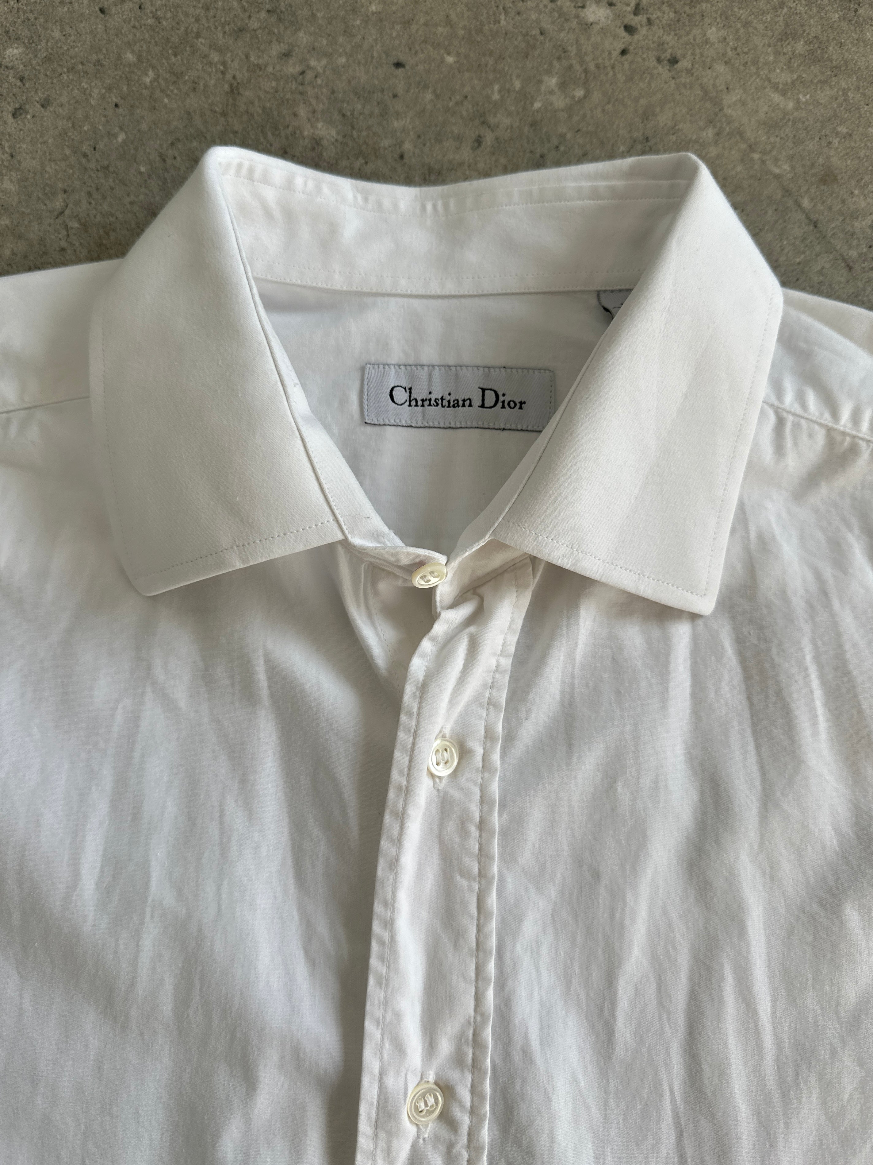 Christian Dior cotton dress shirt in size large/extra large, featuring classic collar and button-down front on a white background.