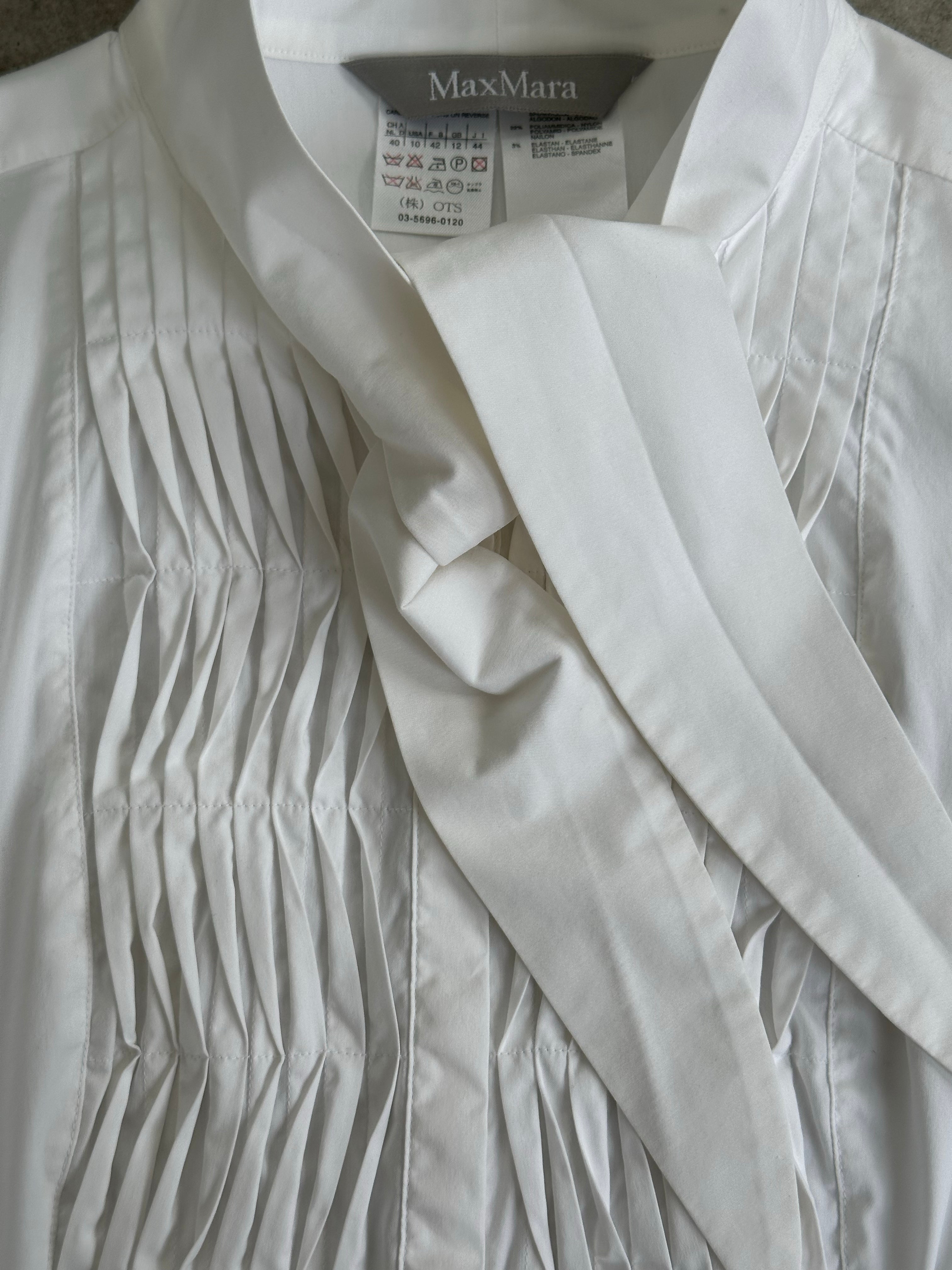 Max Mara 2000s cotton pussy bow tuxedo shirt in size S, featuring a classic white shirt with a bow tie detail and button front.